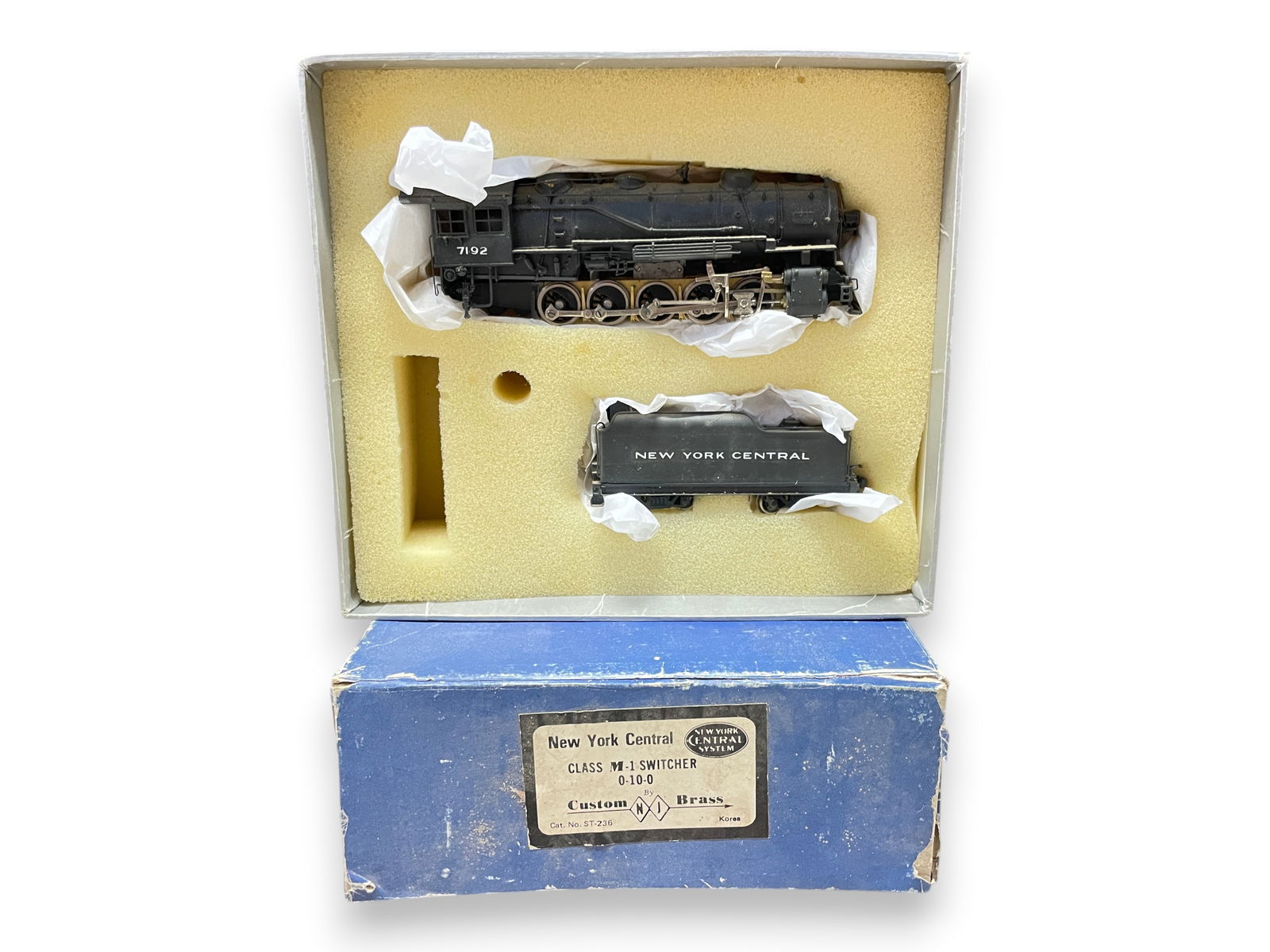 NJCB Brass HO NYC M1 Switcher: HO Gauge. Custom painted 0-10-0 steam switcher with Can motor and headlight #7192. Has detailed cab control bulkhead. Tender appears to have a back-up light. It shows light play wear, a bit dusty