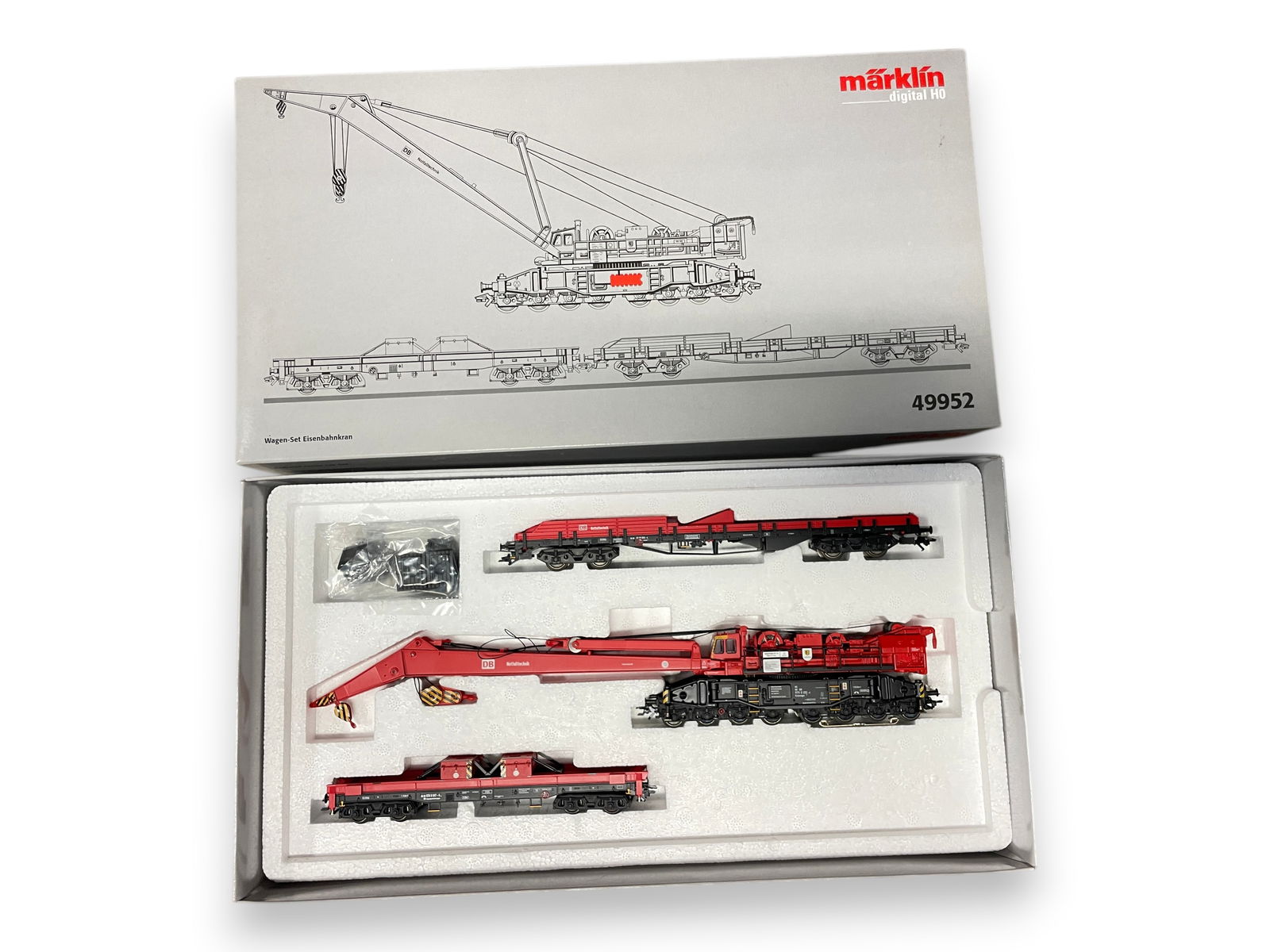 Marklin 49952 Digital Goliath Crane: HO Gauge. One of Marklin Best! Multi-Function crane with 2 tender flats. It is new in set box. Shipping: Weiss Auctions offers full-service, in-house shipping for nearly all items in this auction. For