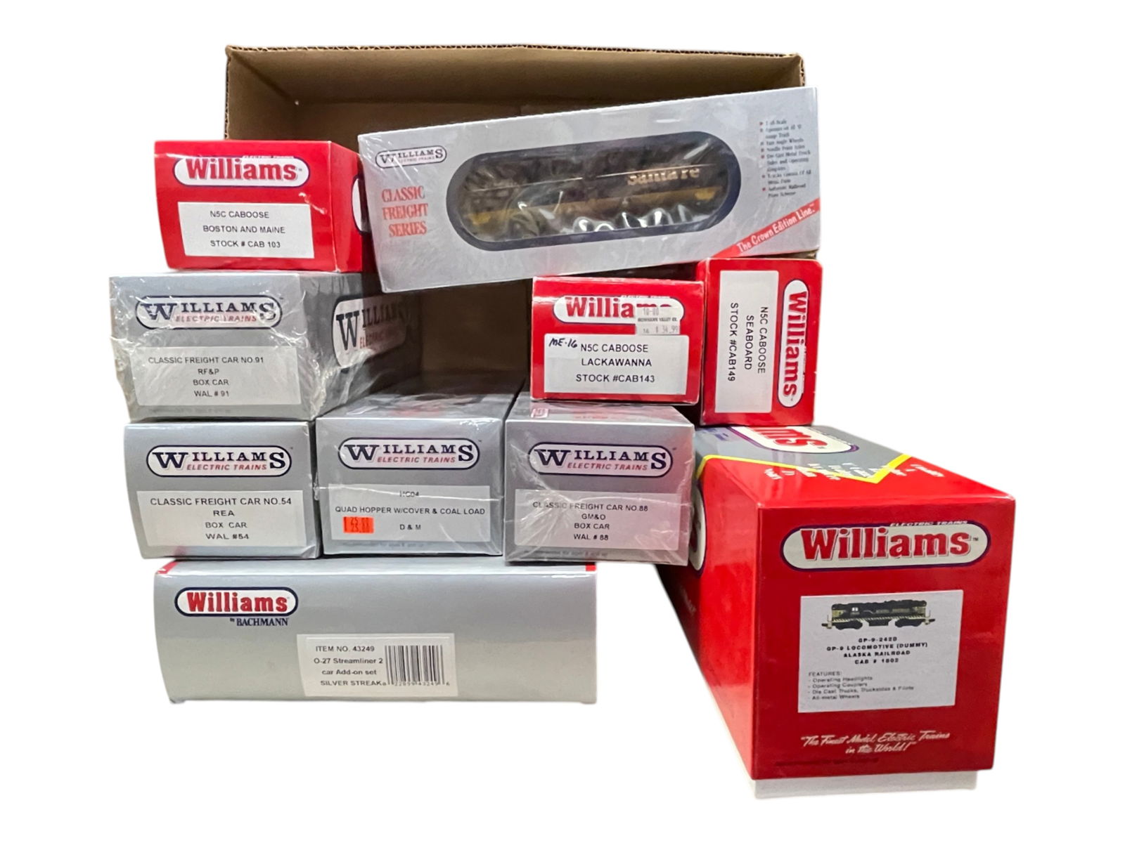 10pc Williams Train Group: Includes a GP9252D Alaska GP9 Dummy with headlights; 43249 Silver Streak Add-on 2-car set; 8 assorted freight cars. Most show light run time all with boxes, 3 are Mint, Sealed. See photos for lot