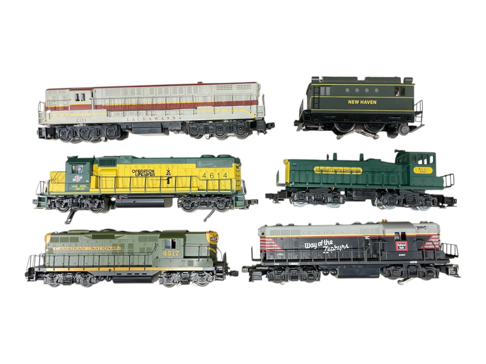 6 Assorted Modern Locomotives: Includes a Williams Lackawanna FM; K-Line C&NW GP38; Lionel CB&Q GP7; K-Line SW1; and 2 others as photoed. Some trim issues, all are fairly clean, showing? light play wear. Examine Photos. Sold