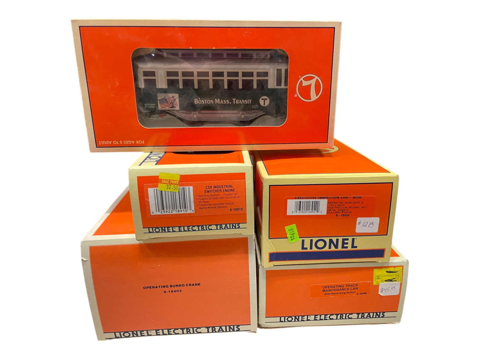 5 Lionel Motorized Units: Includes 18402 Burro Crane; 18454 Blue Inspection car; 18910 Ind Switcher; 18452 Boston Trolley; 18406 Track Maintenance Car. All show light run time with boxes, Burro's is faded.Shipping: Weiss