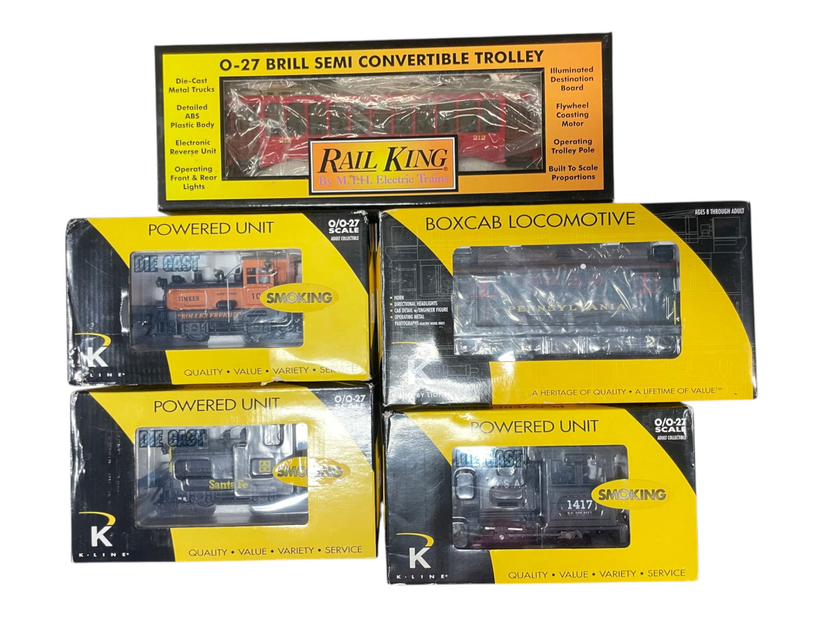 5 Modern Motorized Units: Includes an MTH 30-2512-0 Brill trolley; K-Line K2630-25 Timken Smoking Switcher; K2630-09 ATSF Smoking Switcher; K2631-06 US War Dept Porter Switcher; 21267 PRR Box cab w/horn. All show light run