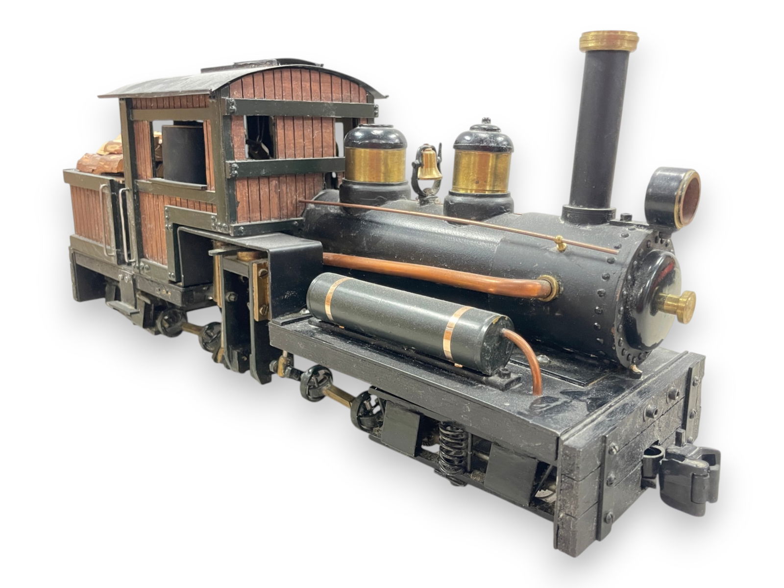 1 Gauge Custom Build Live Steam Shay: Marked Geoff Built, Made in Canada. It is brass, copper & wood with k/c for G gauge. It was well thought out and nicely constructed. Its a bit dusty from display, but will make a unique addition to