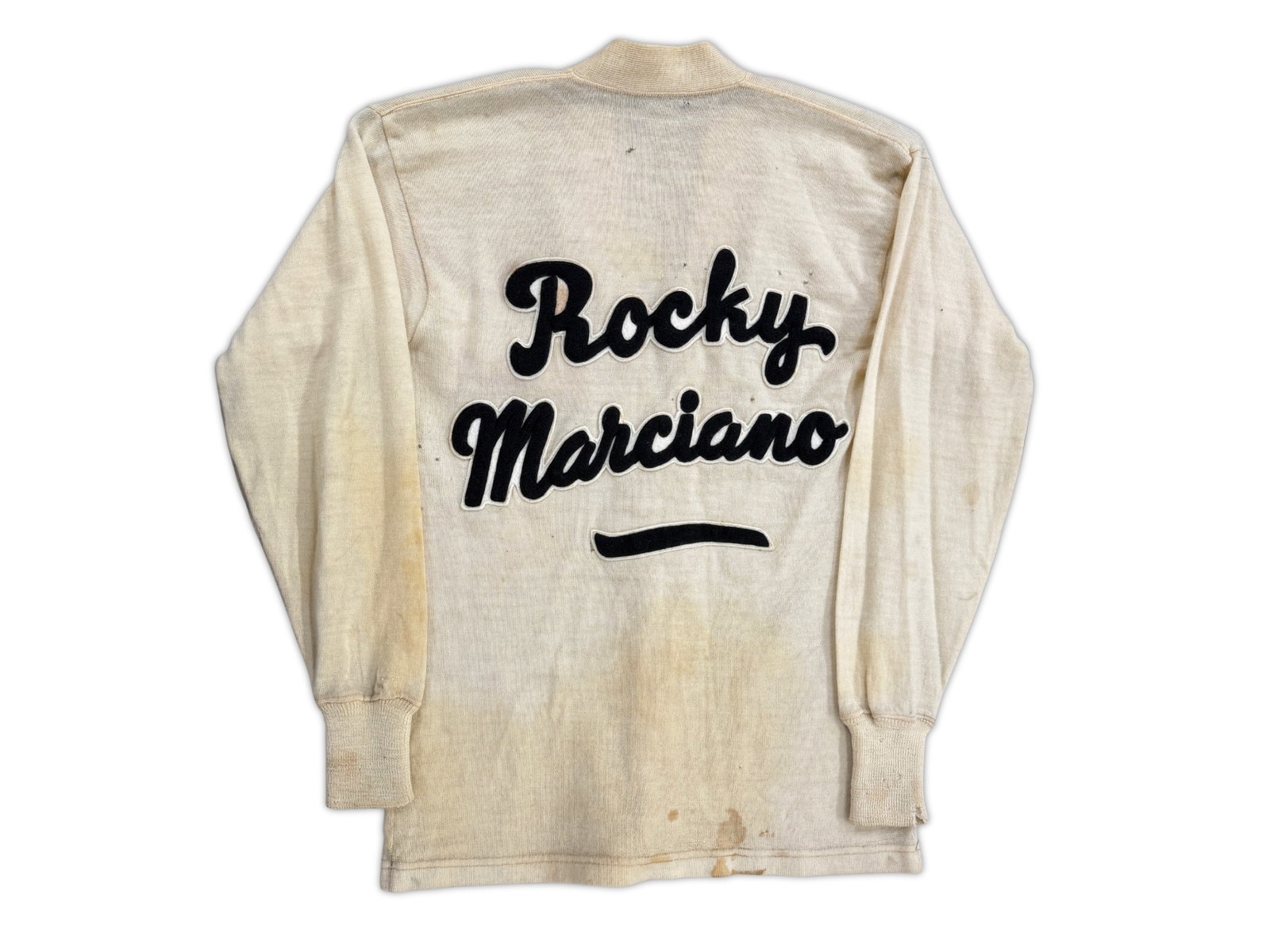 Al Mandy Rocky Marciano Cornerman Sweater: Fight-worn cornerman's sweater attributed to Rocky Marciano trainer Al Mandy, an extremely scarce piece of boxing memorabilia tied to the undefeated 49-0 heavyweight champion. The sweater shows eviden