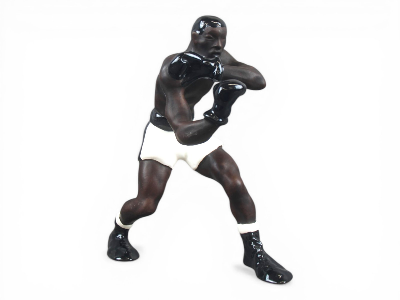 1950/60's Italian Porcelain Black Boxer Figurine: Approx. 10.5" tall. Light surface scuffs and scratches. No noticeable chips, or repairs, however areas of crazing throughout. Shipping: Weiss Auctions offers full-service, in-house shipping for nearly