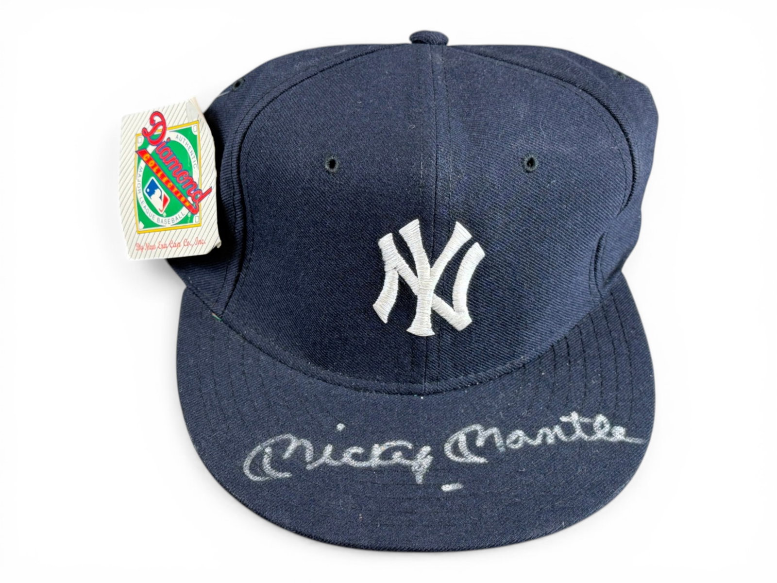 Mickey Mantle Signed Yankees Hat - JSA: New Era Diamond Collection New York Yankees cap signed by Mickey Mantle across the brim in silver paint pen. Mantle spent his entire 18-year career with the Yankees and was the centerpiece of the club