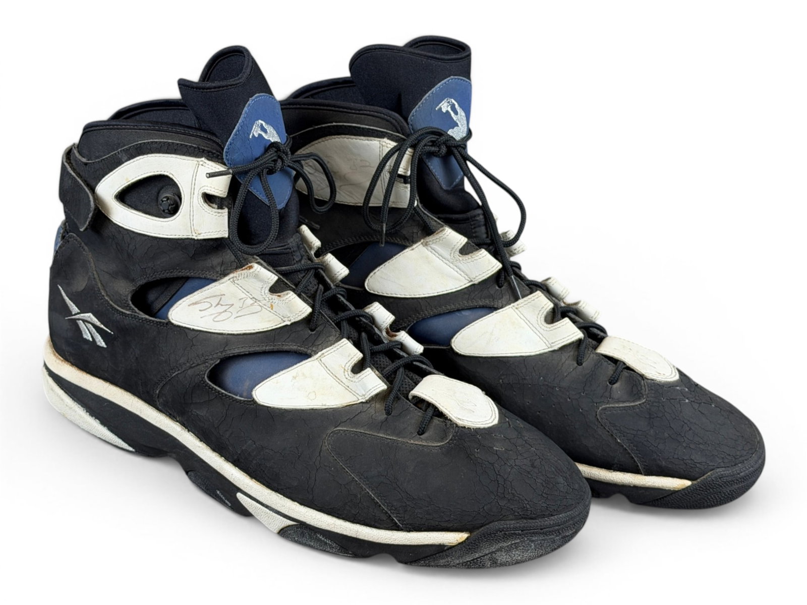 Shaquille O'Neal Game Worn Signed Reebok Shoes - JSA: Pair of Reebok Shaq Attaq IV basketball sneakers, size 22, game worn by Shaquille O'Neal during his early Orlando career. Both shoes are signed "Shaq 32," with each signature authenticated by JSA (ZZ9