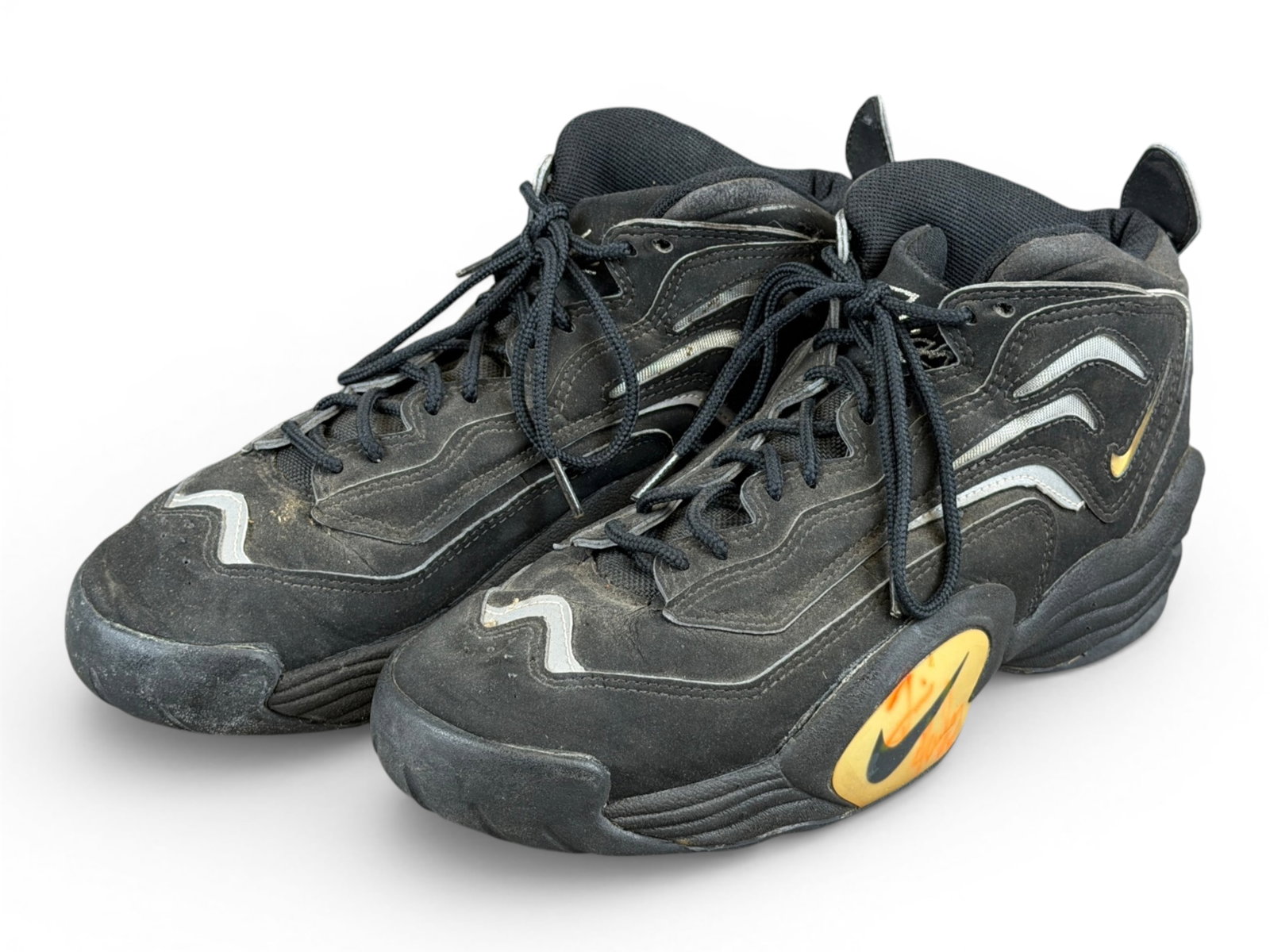 Tim Hardaway Game Worn Signed Nike Air Flight: Pair of Nike Air Zoom Flight 95 basketball sneakers, player exclusive, game worn by Tim Hardaway during the 1996-97 season with the Miami Heat. Both shoes are signed by Hardaway in orange/red ink on t