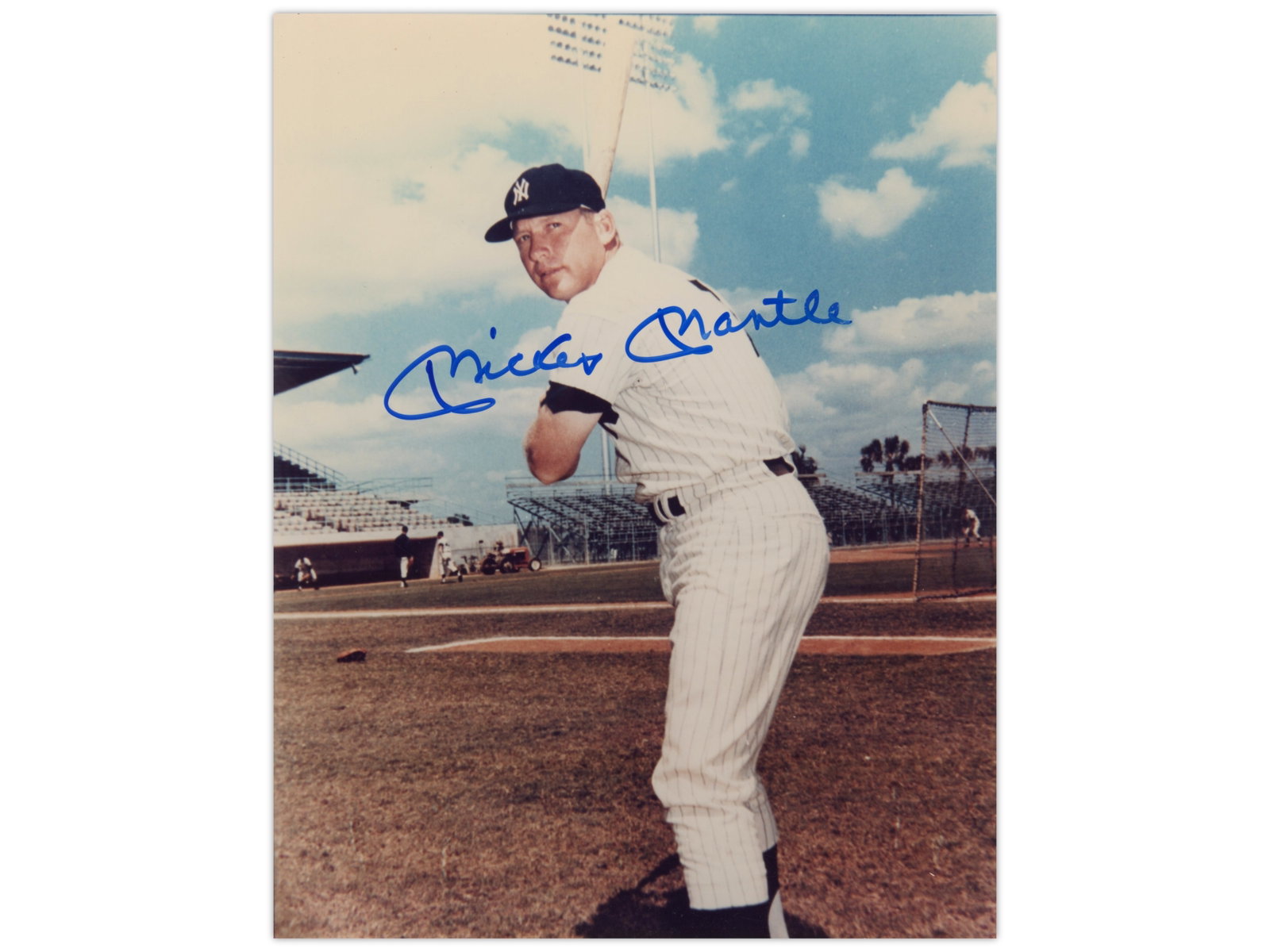Mickey Mantle Signed 8x10 Photo - JSA: Color 8 x 10 photograph of Mickey Mantle posed with bat over his shoulder, signed across the image. Mantle was a three-time American League Most Valuable Player, a 20-time All-Star, and one of the mos