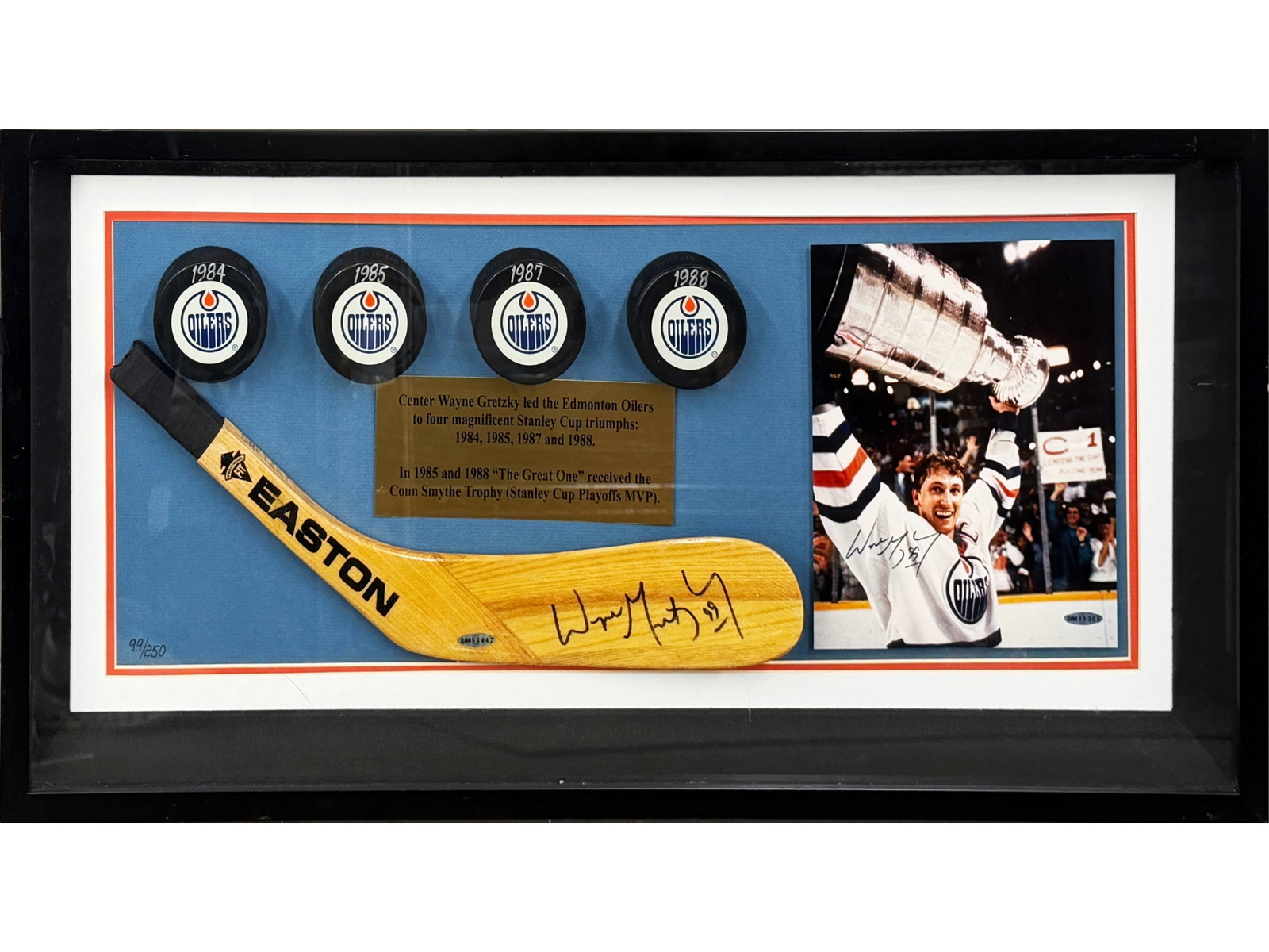 Gretzky Signed Stick Blade & Signed Photo UDA /250: Limited edition display honoring Wayne Gretzky's success with the Edmonton Oilers, numbered 99/250, with the limitation matching his iconic jersey number. Includes an Easton hockey stick blade signed 