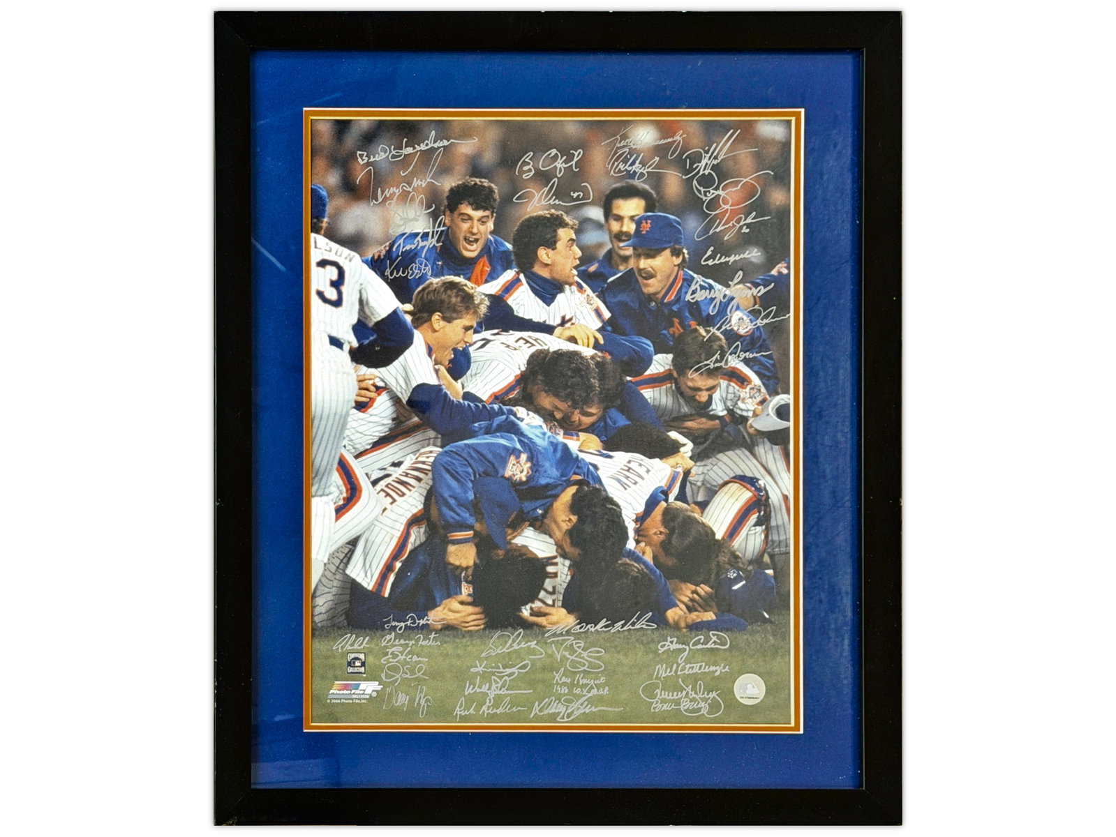 1986 Mets World Series Champs Team Signed Photo: Approx. 35 signatures, all signed in silver sharpie. Includes: Wally Backman, Keith Hernandez, Barry Lyons, Ray Knight, Mookie Wilson, Tim Corcoran, George Foster, Lenny Dykstra, Gary Carter, Mel Stot