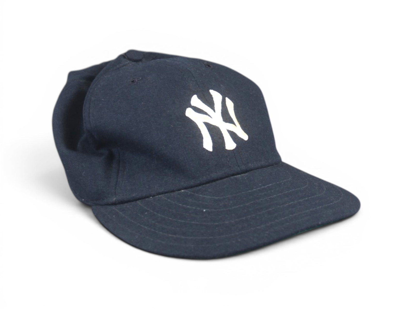 1980's Don Mattingly Yankees Signed Game Worn Cap: Offered is a signed and game worn New York Yankees cap, worn by Don Mattingly. New Era tagging, and size 7-1/4, dates this to the mid 1980's. New Era tag is also marked "Authentic Major League Pro Mod