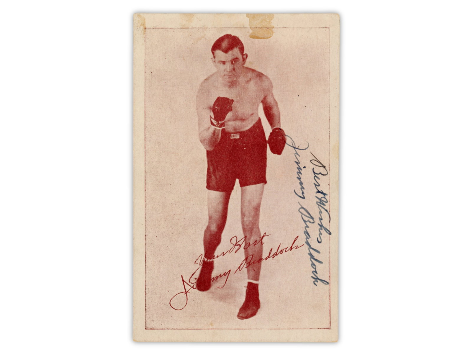 James J. Braddock Signed Postcard: Postcard for the "Inn Braddock's Corner" restaurant in New York City, measuring approximately 3.5 x 5.5 inches, featuring a full-length boxing portrait of James J. Braddock on the front. Signed in blu