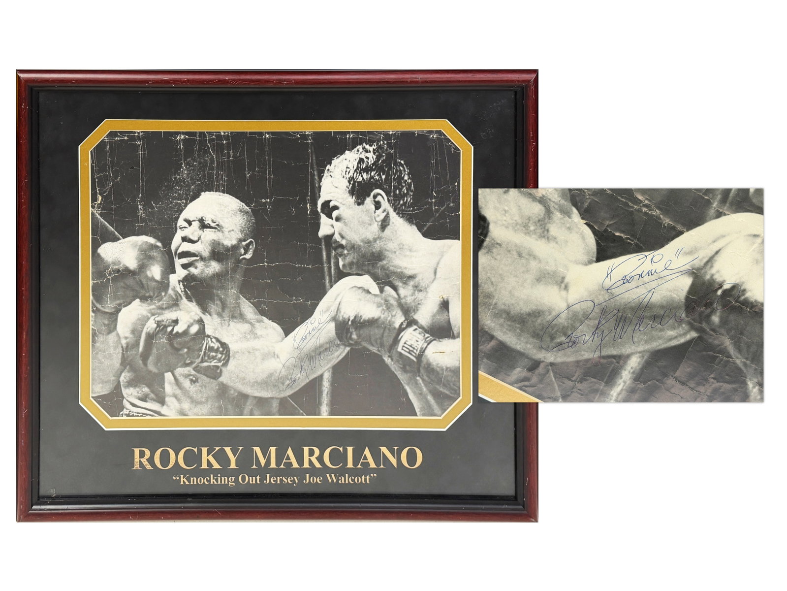 Rocky Marciano Signed Poster - JSA: Framed black-and-white Rocky Marciano display poster titled "Knocking Out Jersey Joe Walcott," featuring Marciano landing a punch during the historic heavyweight championship fight. The poster is sign