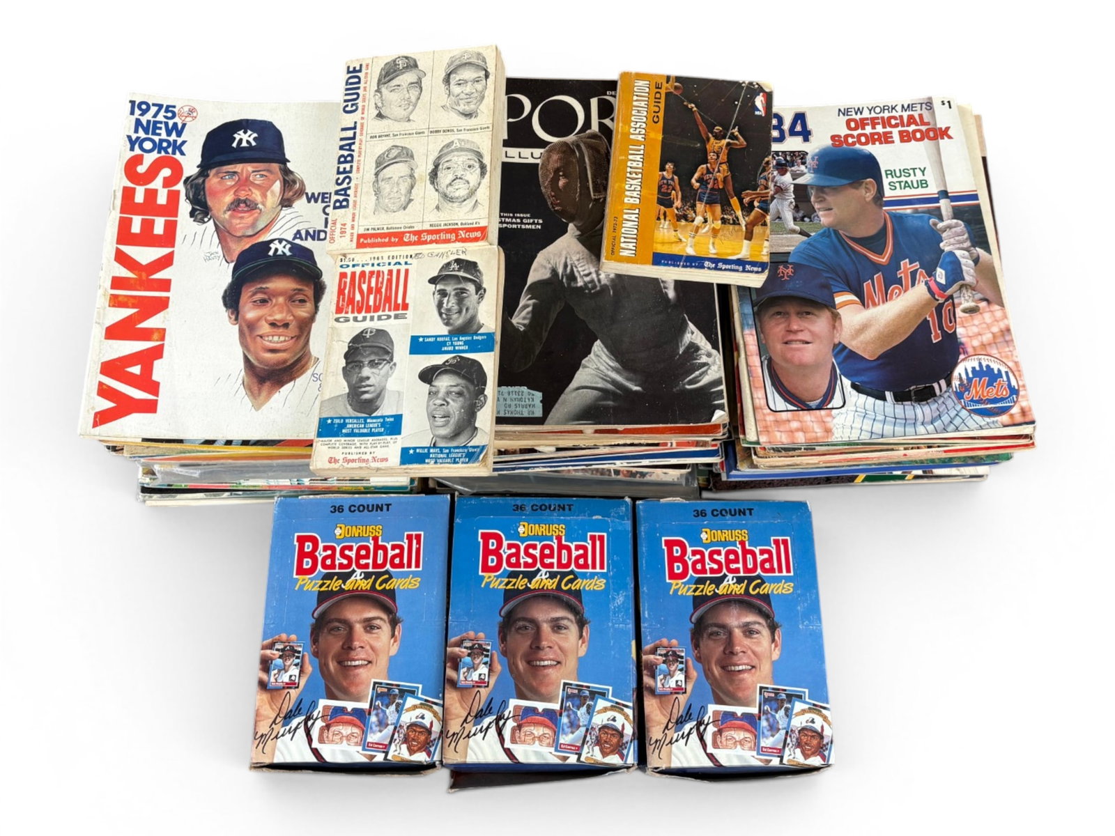 Large Sports Yearbook, Program, Magazine Collection: Large sports publication lot including New York Jets yearbooks from 1967, 1972, 1975, 1977, 1978, and 1979; New York Mets yearbooks from 1965, 1967, 1975, 1976, 1977, 1978, and 1980; and New York Yank