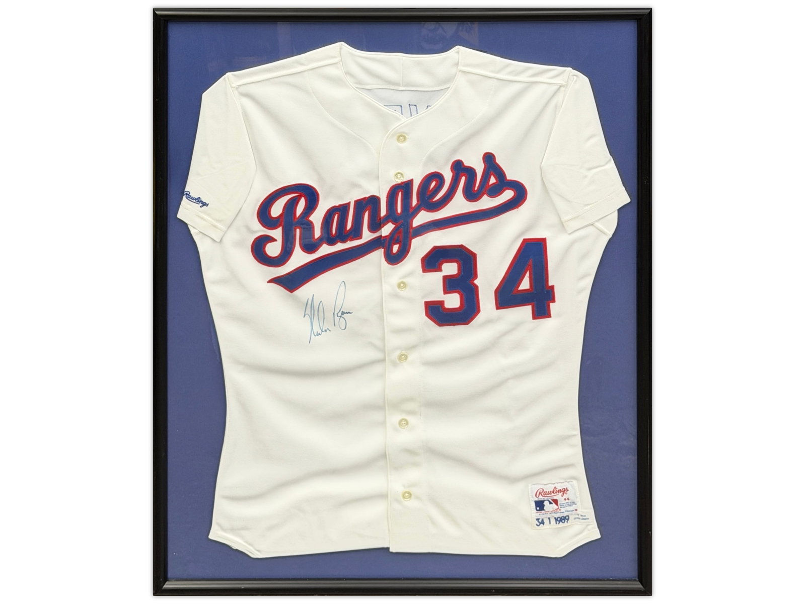 Nolan Ryan Signed Rangers Jersey: Framed team issued with set tags Texas Rangers jersey signed by Nolan Ryan. Ryan is a Hall of Fame pitcher and MLB all-time leader in strikeouts with 5,714. Signature applied in marker Shipping: Weiss
