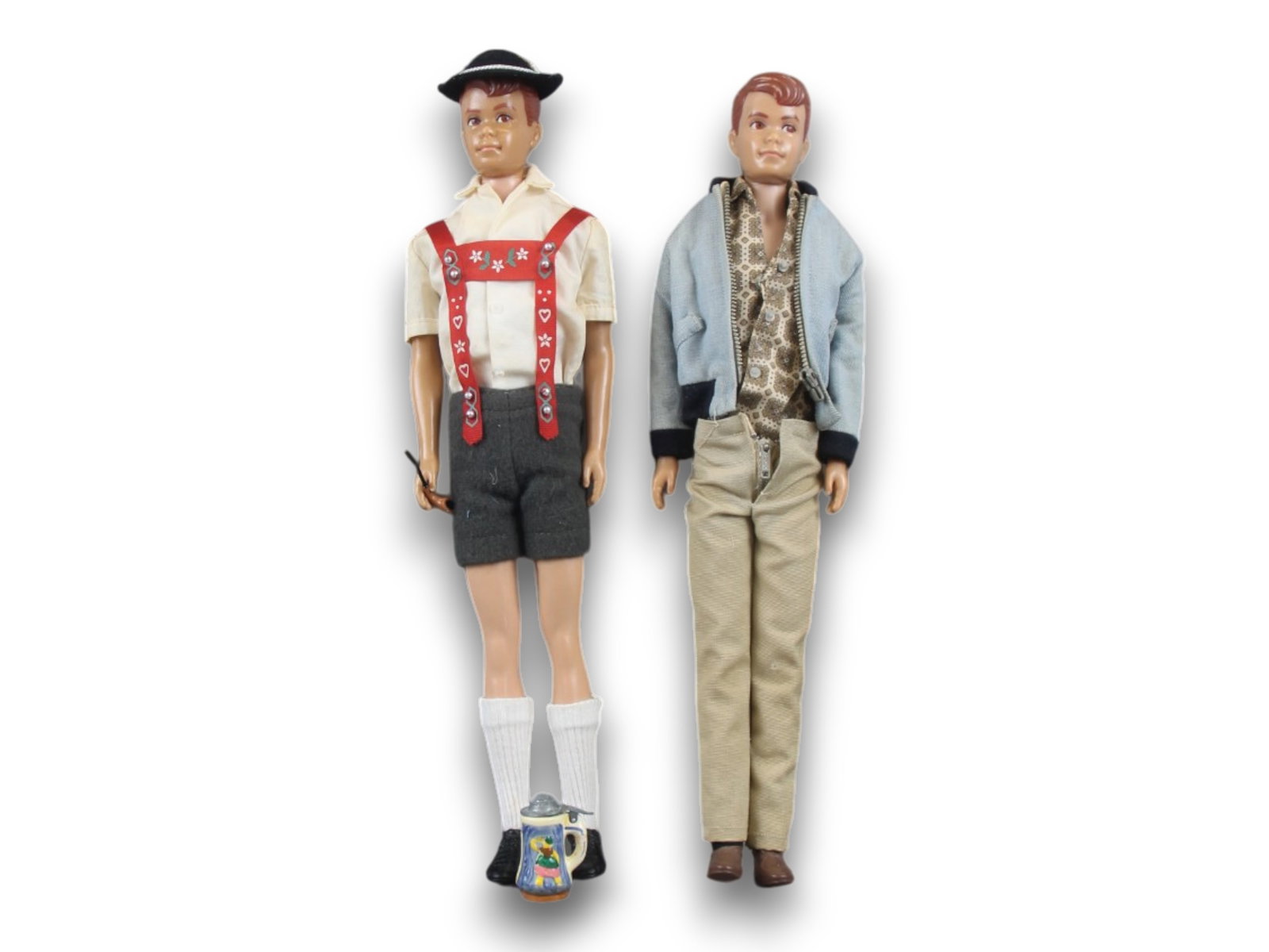 (2) 1964 Allan #1000 Dolls with Ken Fashions: Mattel, 1964. Lot of (2) straight leg Allan #1000 dolls. Both marked: ?1960/by/Mattel, Inc./ Hawthorne/Calif. U.S.A. Each features molded auburn hair and brown eyes. Both are dressed in Ken Fashion Ou