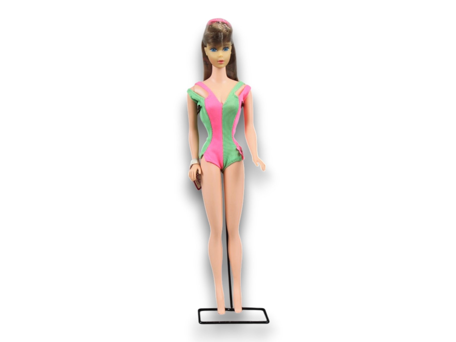 1971 Standard Straight Leg Barbie #1190 w/Swimsuit: Lot consists of a 1971 Standard Straight Leg Barbie Doll #1190. Blonde hair with center glanced eyes, and original tagged swimsuit. Marked: Midge T.M. ?1962 Barbie? ?1958 by Mattel, Inc. Patented. Wri