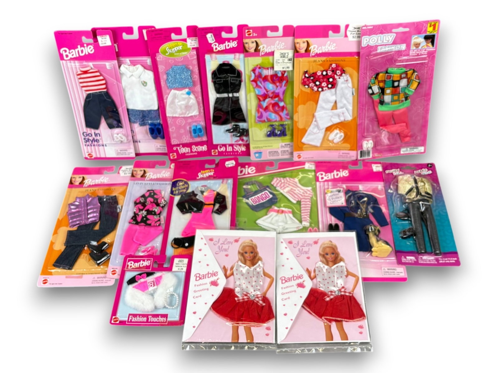 (16) Barbie & Clone Doll Clothes: Sixteen Barbie, Skipper, and Barbie clone clothing items, all NRFB in original packaging. Circa 1980s-1990s. Shipping: Weiss Auctions offers full-service, in-house shipping for nearly all items in thi