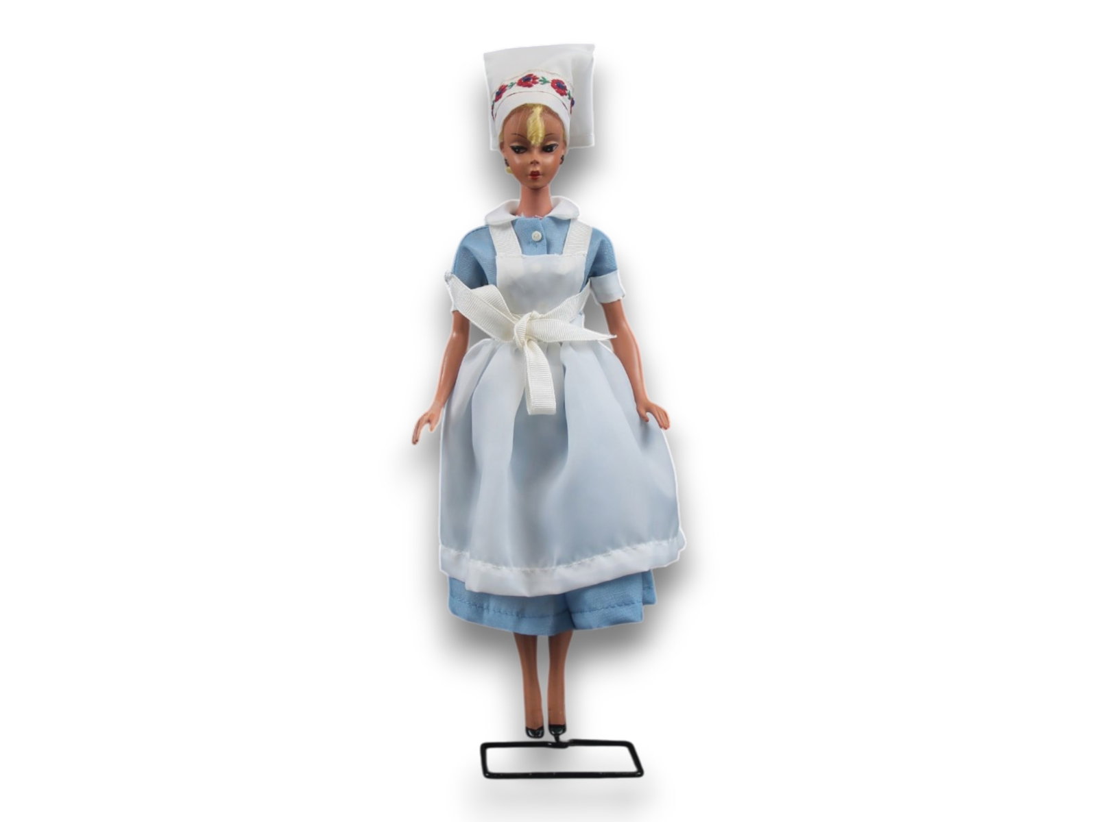 Original German Bild Lilli Doll, 11-1/2": German "Bild Lilli", 11-1/2" doll with molded and painted facial features, side-glancing eyes with molded lashes, high arched eyebrows, blonde inset wig styled in a ponytail with curl on her forehead,