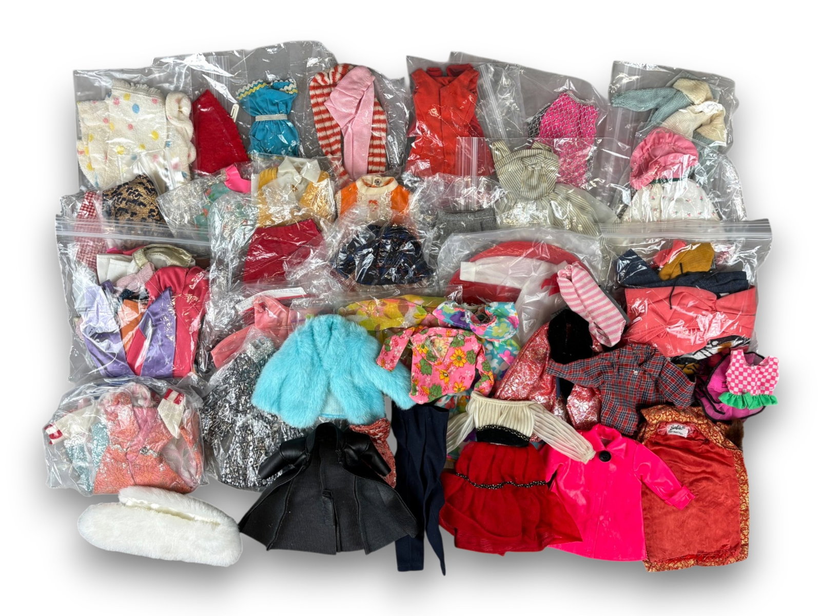 Barbie Sized Doll Clothes Assortment: Box lot of Barbie sized clothing including Donny Osmond and other doll items. Circa 1960s-1980s. Shipping: Weiss Auctions offers full-service, in-house shipping for nearly all items in this auction. F