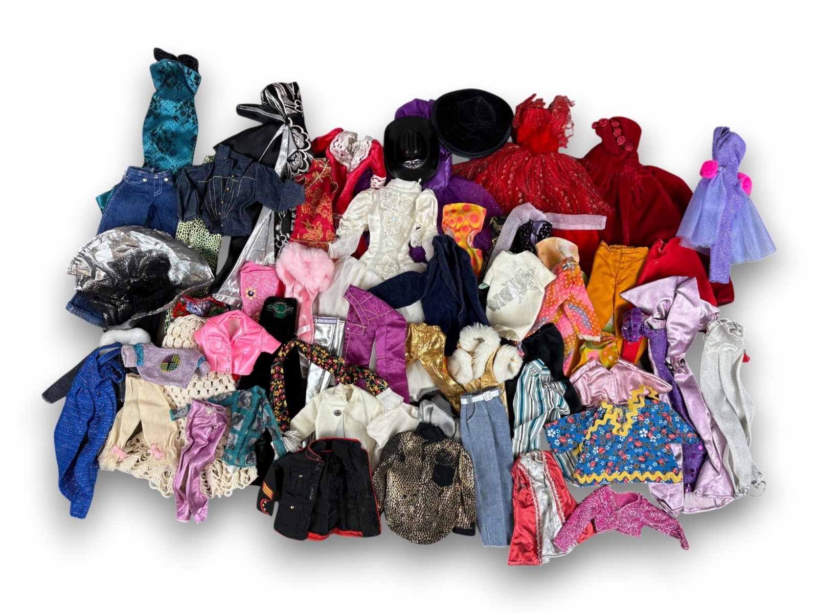 Barbie Clothes Assortment: Box lot of untagged Barbie and Barbie sized clothing. Circa 1990s. Shipping: Weiss Auctions offers full-service, in-house shipping for nearly all items in this auction. For a shipping quote, please