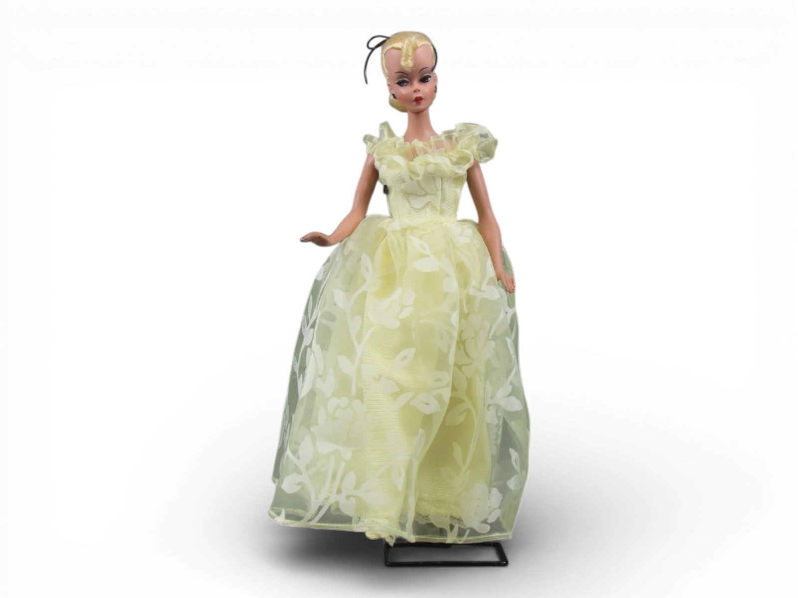 Original German Bild Lilli Doll, 11-1/2": German "Bild Lilli", 11-1/2" doll with molded and painted facial features, side-glancing eyes with molded lashes, high arched eyebrows, blonde inset wig styled in a ponytail with curl on her forehead,