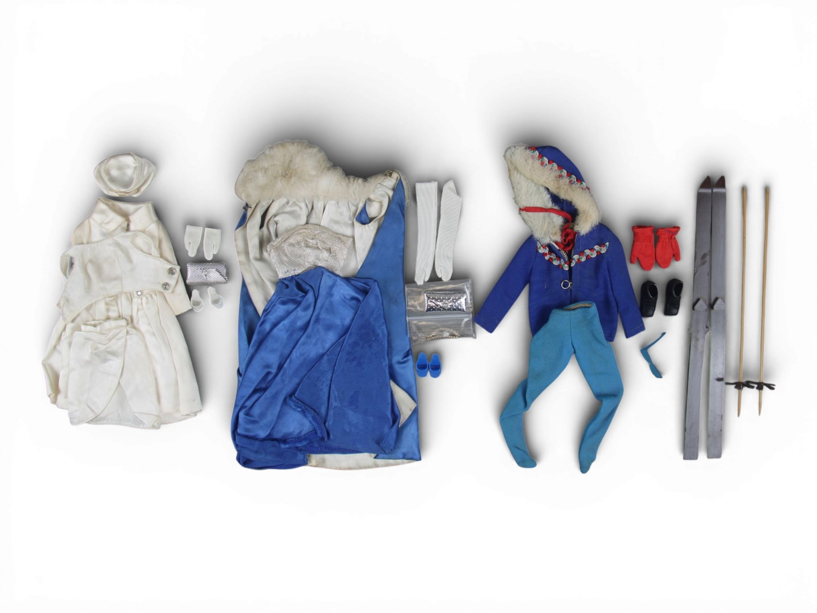 (3) Vintage Barbie Fashion Outfits 1963-1965: Includes 1963 #948 "Ski Queen" with hooded jacket, pants, red gloves, boots, brown skis, wooden ski poles, and blue sunglasses, 1964 #1607 "White Magic" with satin evening coat, pillbox hat, white glo