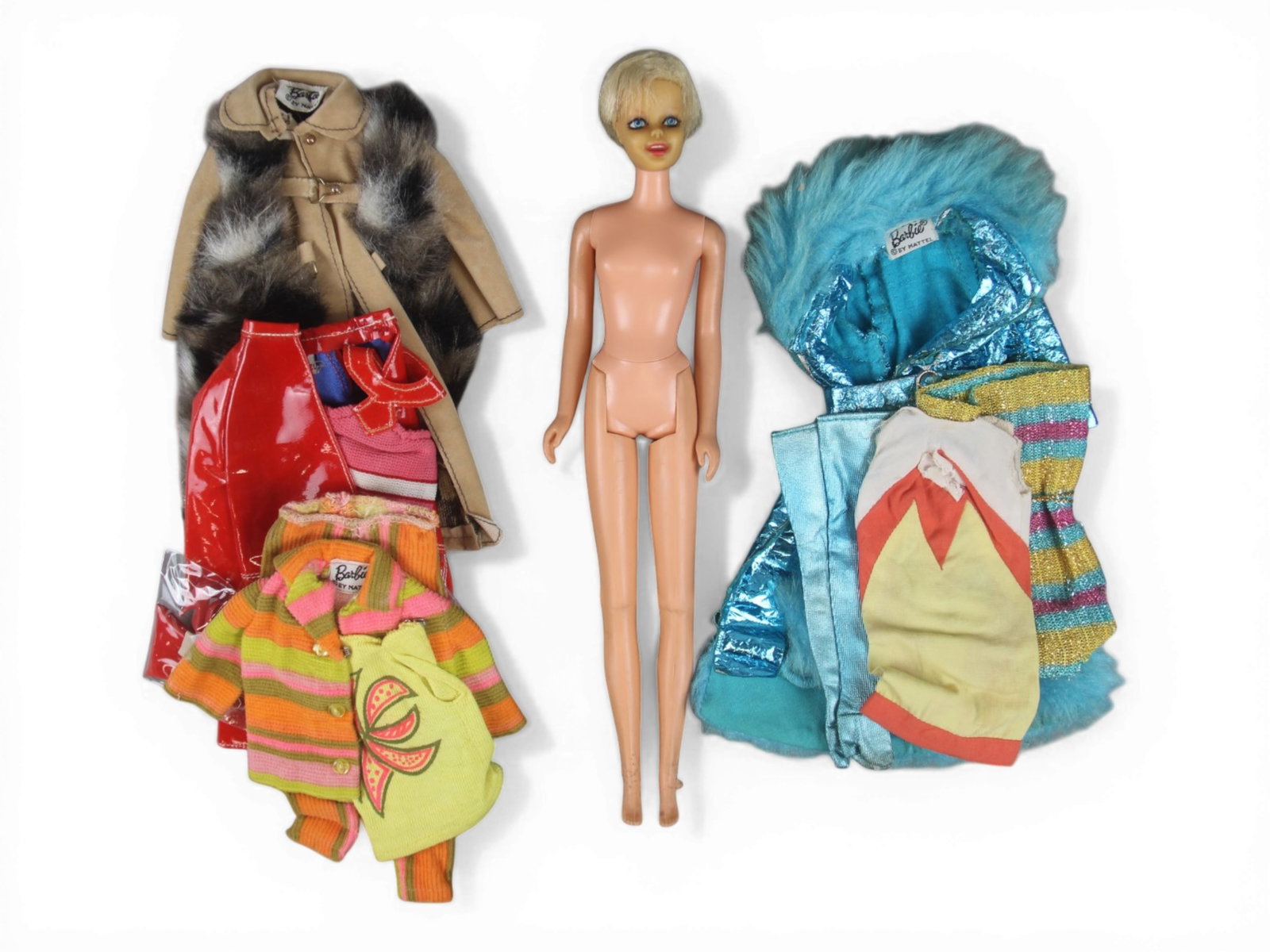 Vintage Twiggy Doll w/(5) Barbie Fashion Outfits: Includes a Vintage 1967 Twiggy doll with bendable legs and twisting waist. Feet show wear with nibbles throughout. Also includes (5) Vintage Barbie fashion outfits including 1967-68 #1691 "Fashion Shi