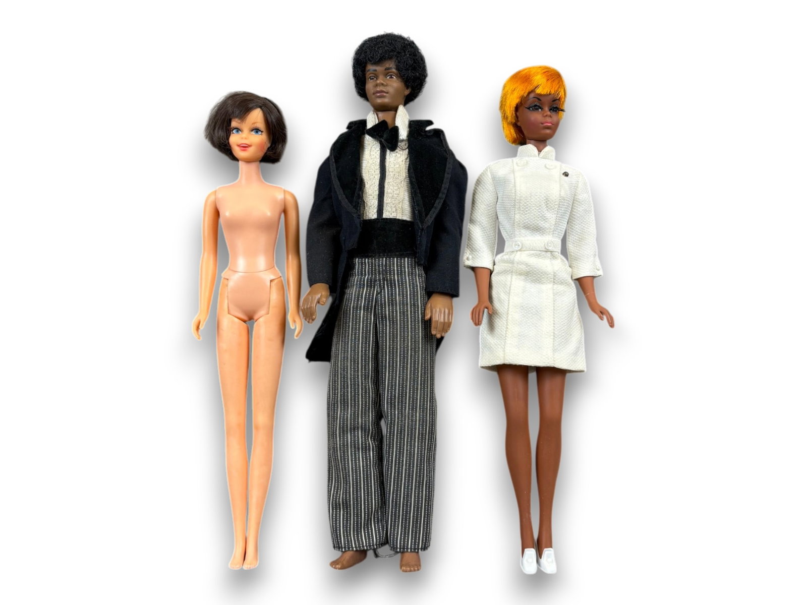(3) Fashion Dolls: Group including Curtis, Julia, and Twist and Turn Casey. Circa 1960s-1970s. Shipping: Weiss Auctions offers full-service, in-house shipping for nearly all items in this auction. For a shipping quote, 