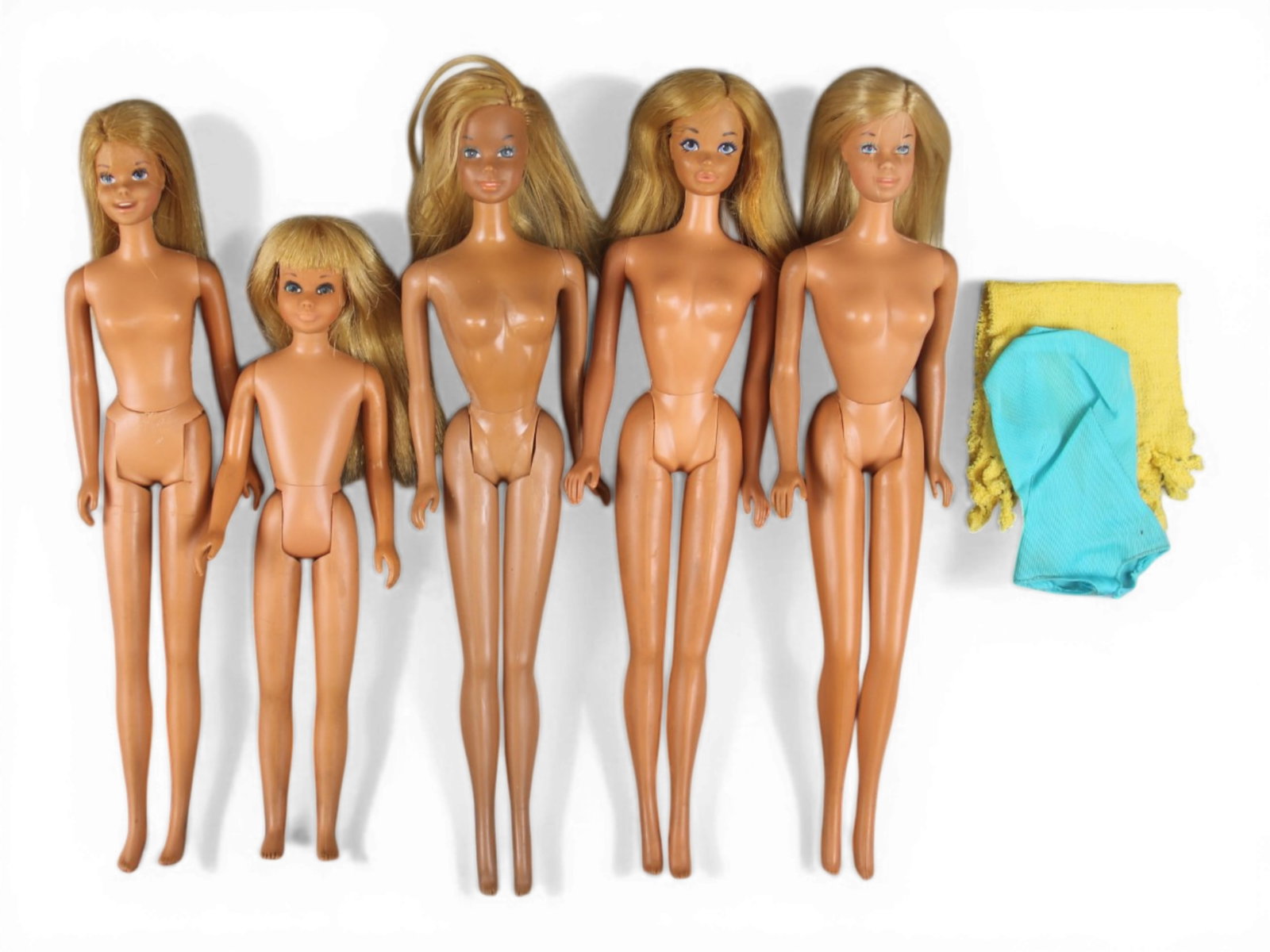 Vintage Lot of Barbie & Friends Malibu Dolls: Includes (2) Malibu Barbie's (1 with towel), Malibu PJ, Francie, and Skipper. Each shows playwear throughout. See images for further condition. Shipping: Weiss Auctions offers full-service, in-house s