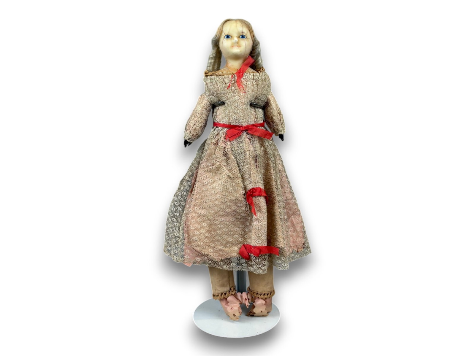 Antique Wax Doll: 15.5 inch wax over papier mache shoulder head on cloth body with original dress and wig. Circa 1840. Shipping: Weiss Auctions offers full-service, in-house shipping for nearly all items in this auctio