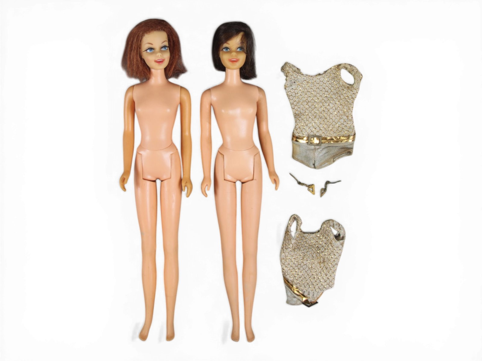 (2) 1967-70 #1180 Casey Twist N Turn Dolls: Red longish hair and brunette hair dolls. Both with original swim suits and one pair of earrings. Each shows light playwear. See images for further condition. Shipping: Weiss Auctions offers full-serv