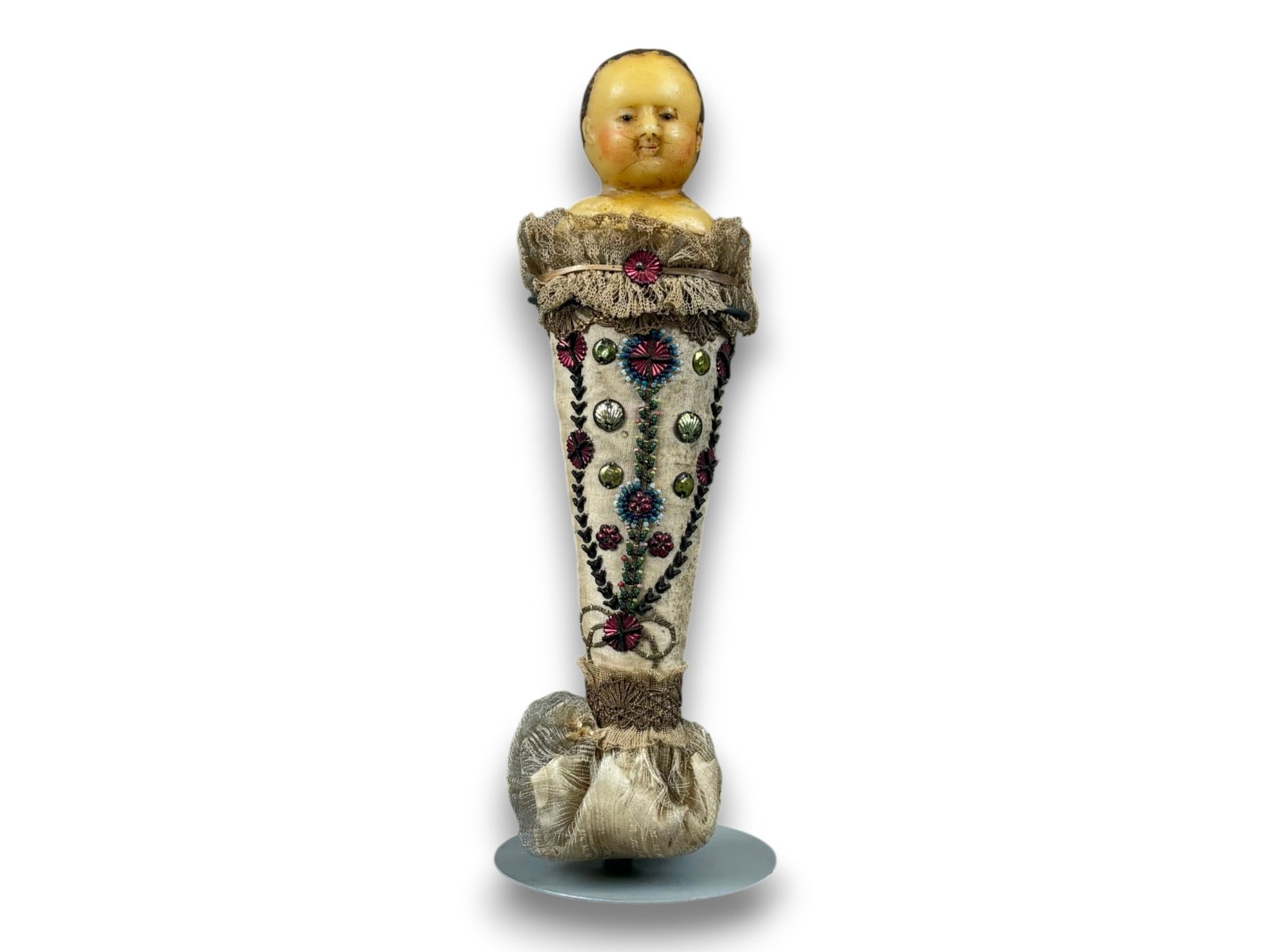 Wax Swaddled Baby Doll: 8 inch poured wax swaddled baby doll. Circa 1840. Shipping: Weiss Auctions offers full-service, in-house shipping for nearly all items in this auction. For a shipping quote, please contact us prior to