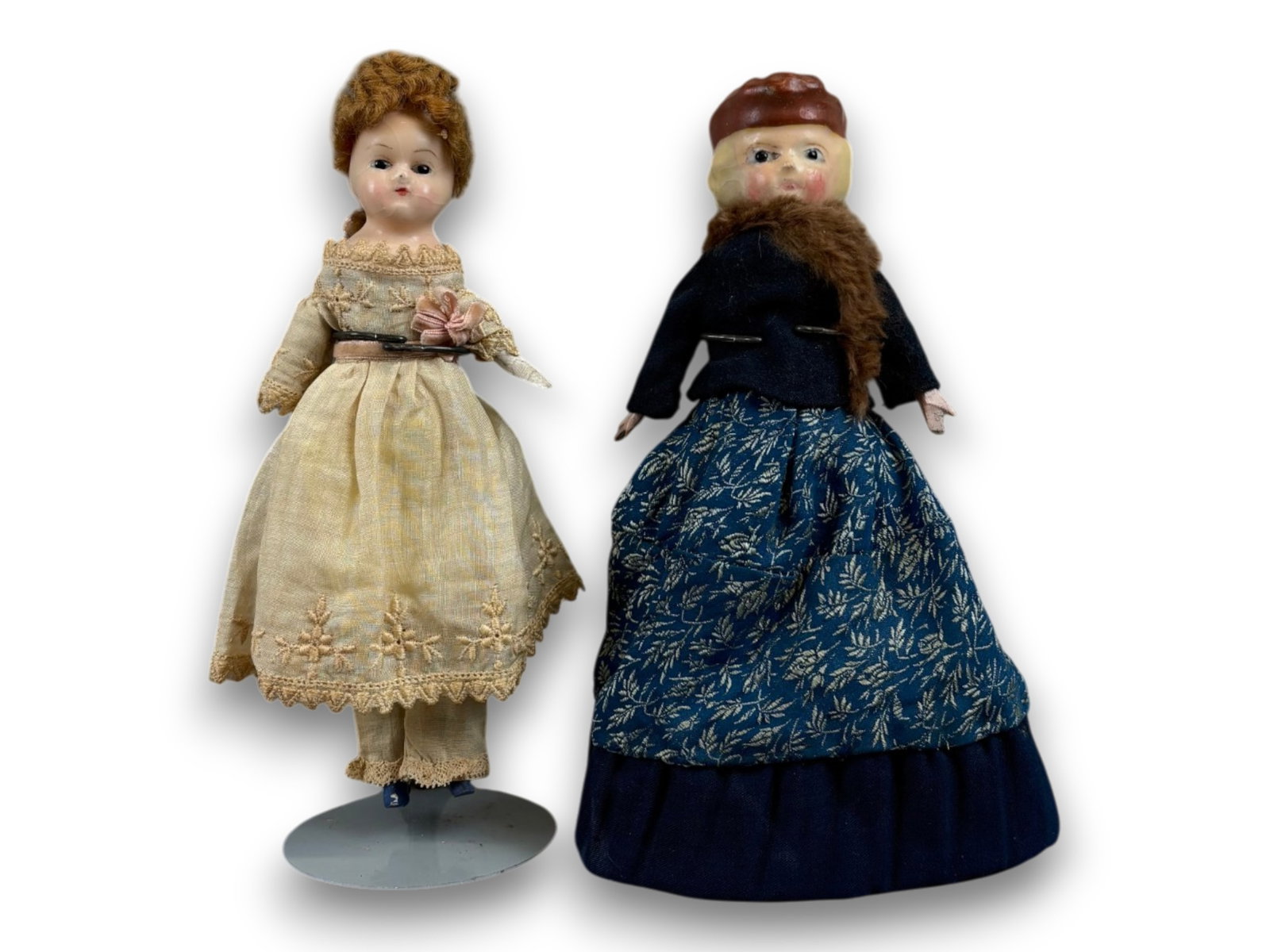 (2) Antique Wax Dolls: Two wax over papier mache dolls with original costumes. Circa 1860. Shipping: Weiss Auctions offers full-service, in-house shipping for nearly all items in this auction. For a shipping quote, please c