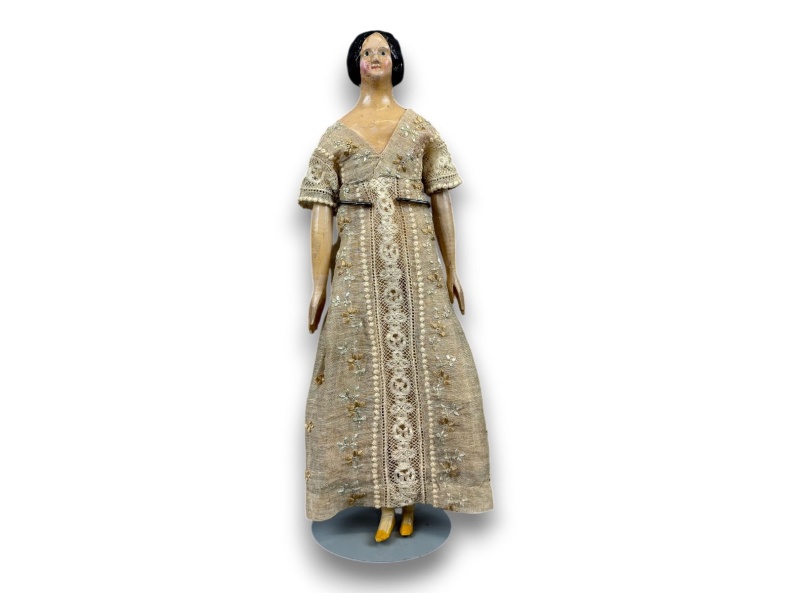 Milliner's Model Papier Mache Doll: 10.5 inch papier mache shoulder head doll with embroidered dress. Circa 1840s. Shipping: Weiss Auctions offers full-service, in-house shipping for nearly all items in this auction. For a shipping quot
