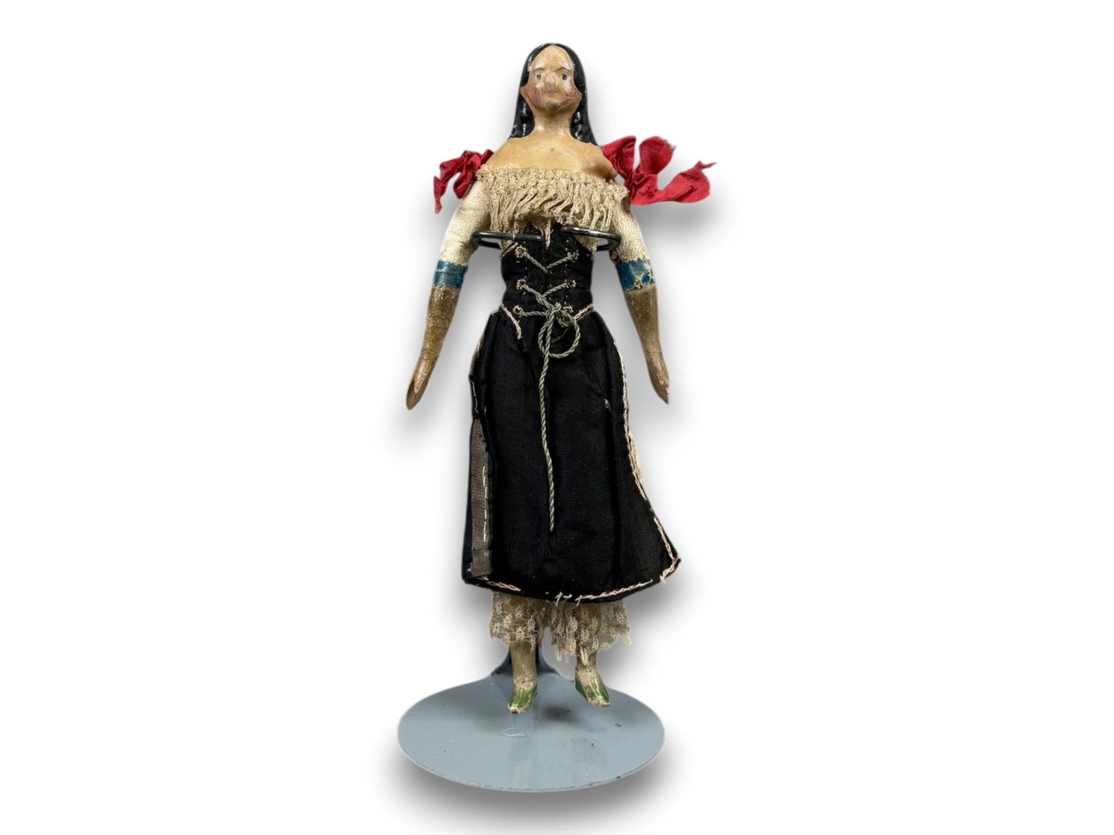 Milliner's Model Papier Mache Doll: 7.5 inch papier mache shoulder head doll with original costume. Circa 1840s. Shipping: Weiss Auctions offers full-service, in-house shipping for nearly all items in this auction. For a shipping quote,