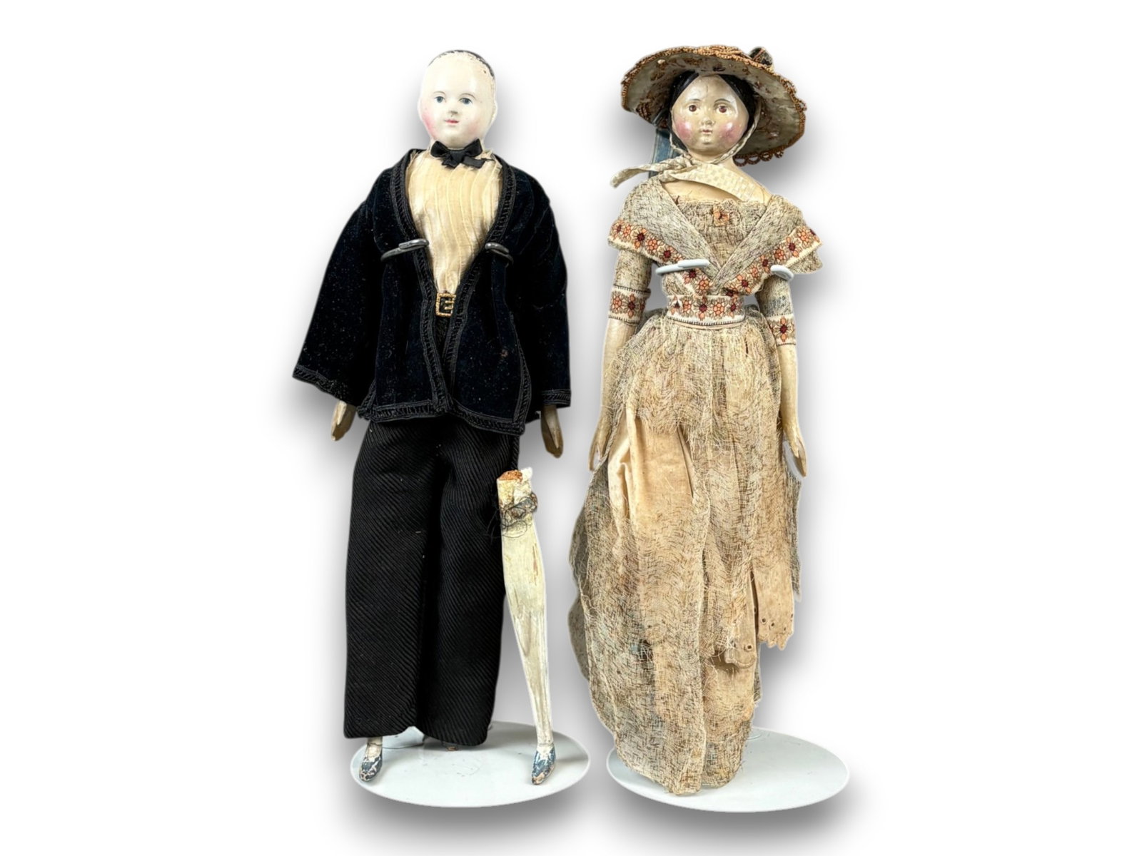 (2) Papier Mache Dolls: Gentleman and lady papier mache dolls with carved wooden limbs. Circa 1860s-1870s. Shipping: Weiss Auctions offers full-service, in-house shipping for nearly all items in this auction. For a shipping 