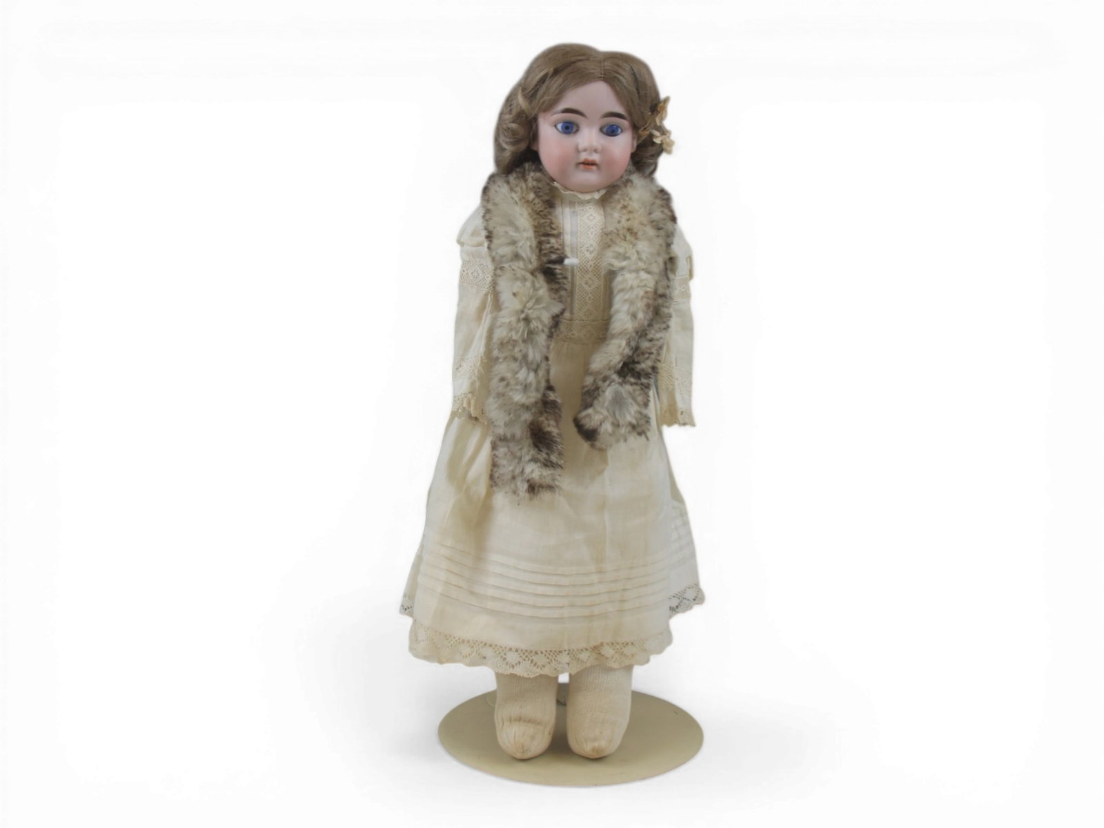 Louis H. Bonvoisin German Bisque Doll: 19.5 inch bisque shoulder head on pin jointed kidskin body with bisque hands. Nice costume. Circa 1900. Shipping: Weiss Auctions offers full-service, in-house shipping for nearly all items in this auc