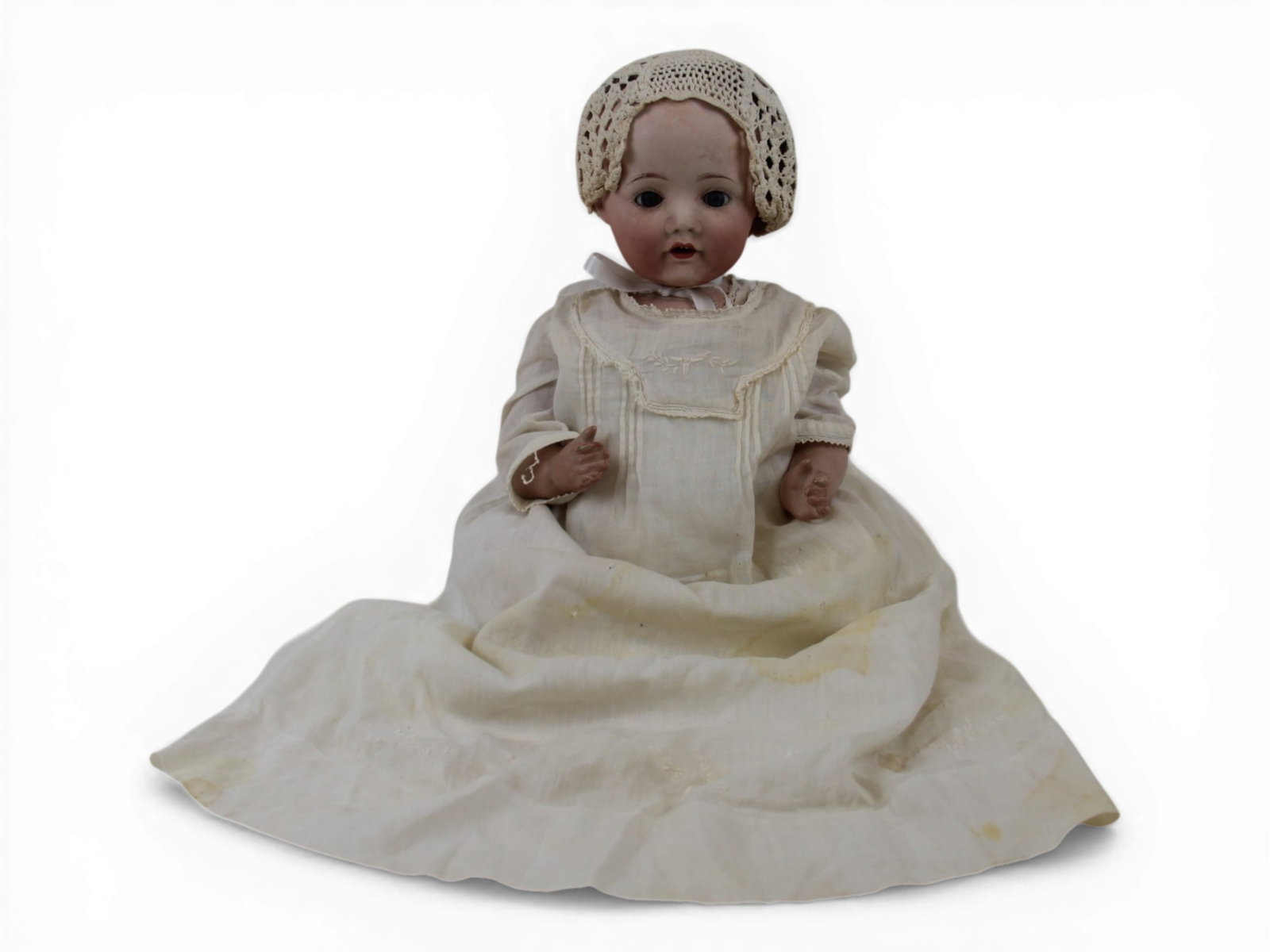 Japanese Nippon Bisque Baby Doll: 19 inch Japanese Hilda type bisque socket head on composition baby body. Circa 1918. Shipping: Weiss Auctions offers full-service, in-house shipping for nearly all items in this auction. For a shippin