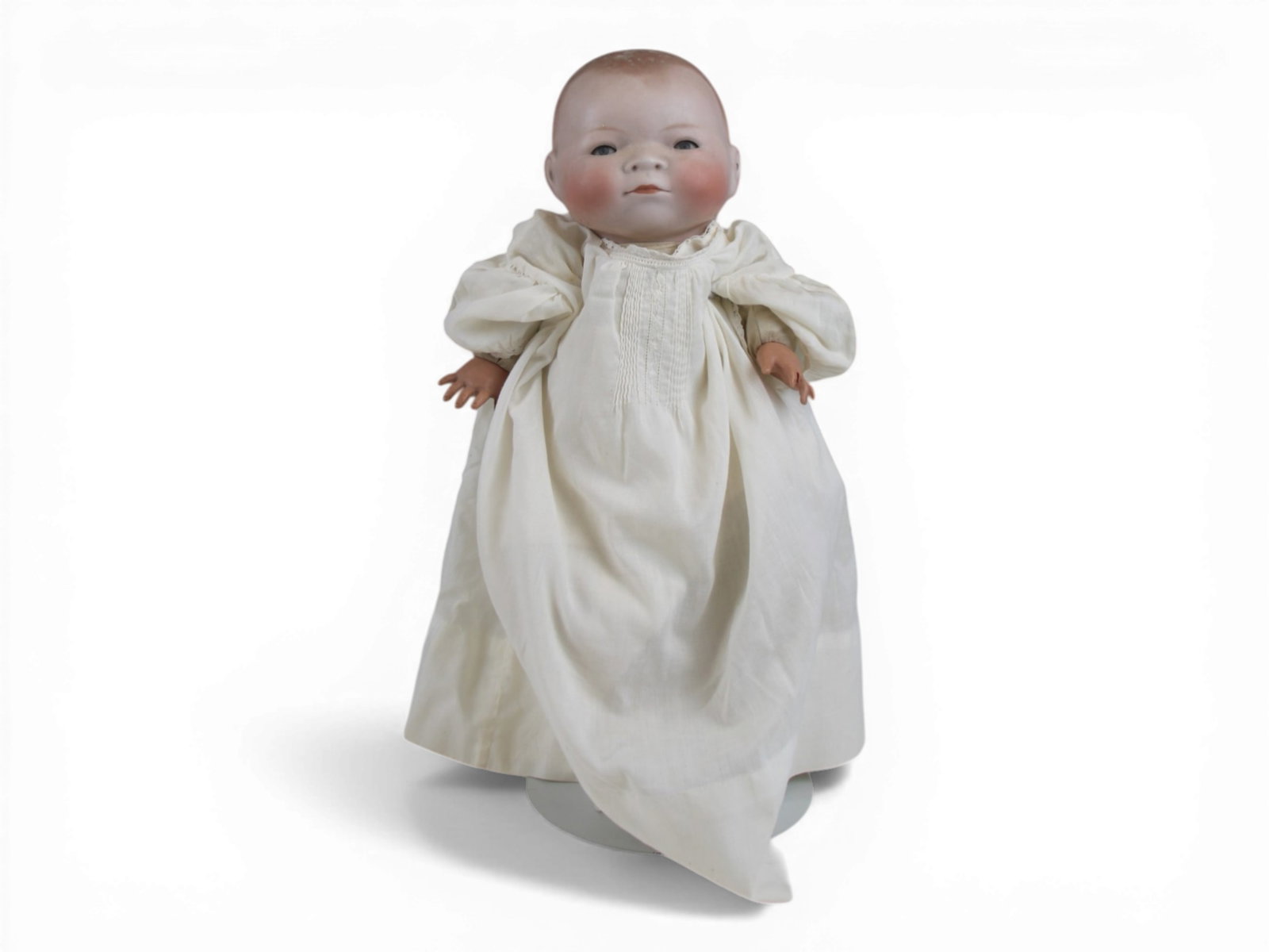 Grace Putnam Bye-Lo Baby Doll: 14 inch Grace S. Putnam bisque flange head on original signed cloth body with celluloid hands. One finger broken with piece attached. Circa 1924. Shipping: Weiss Auctions offers full-service, in-house