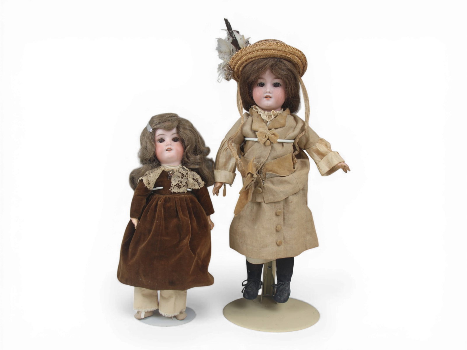 (2) Armand Marseille 390 Bisque Dolls: Two Armand Marseille 390 bisque head dolls measuring 16 and 20 inches on composition and wood jointed bodies with costumes. Circa 1900. Shipping: Weiss Auctions offers full-service, in-house shipping 
