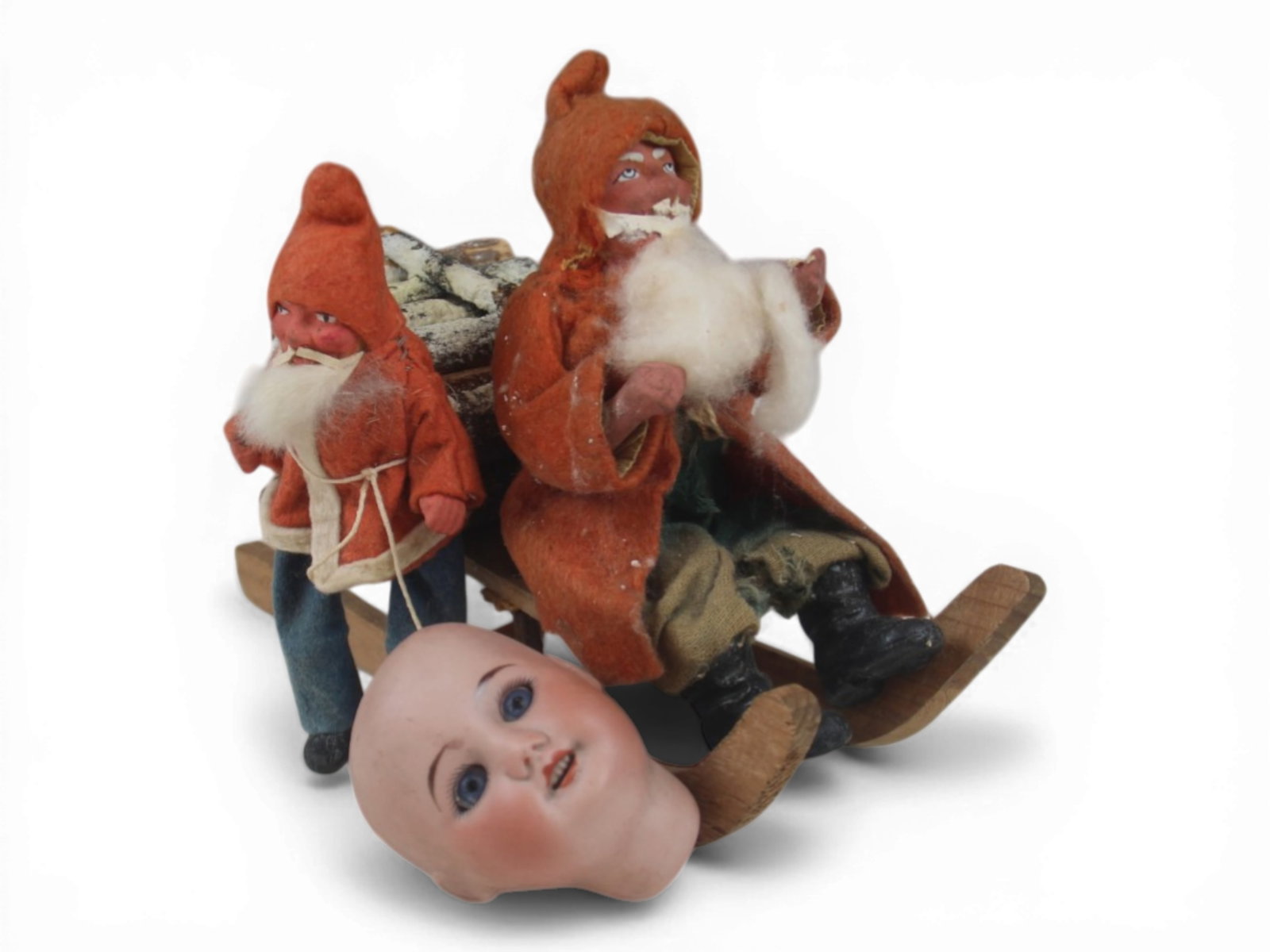(3) Antique Doll & Santa Items: Group including two antique German papier mache Santa figures and a French SFBJ 60 bisque doll head. Circa 1900-1930. Shipping: Weiss Auctions offers full-service, in-house shipping for nearly all ite