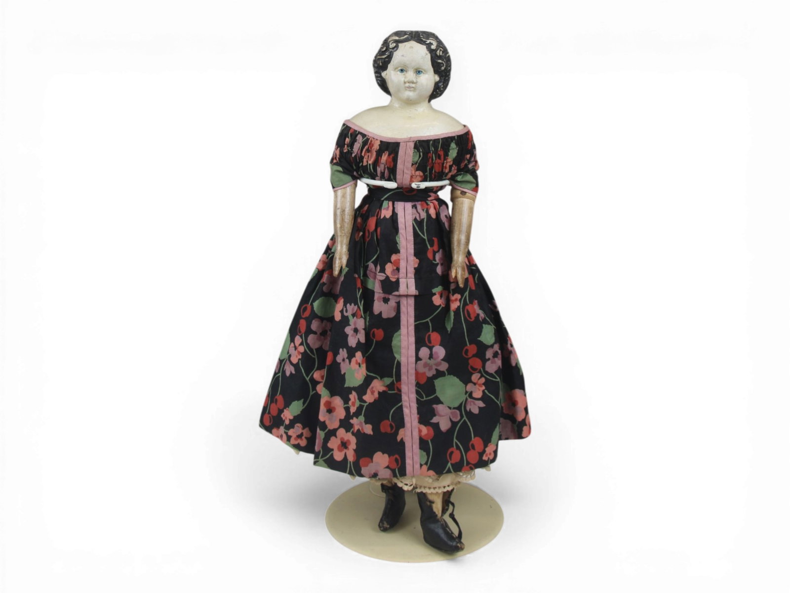 Greiner Papier Mache Antique Doll: 20.5 inch American papier mache doll with cloth body and wooden arms. Circa 1850-1860. Shipping: Weiss Auctions offers full-service, in-house shipping for nearly all items in this auction. For a shipp