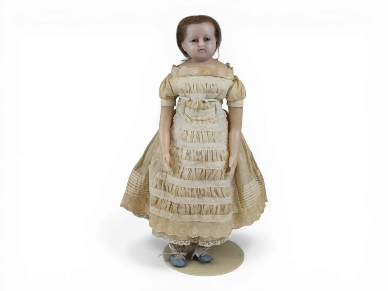 English Poured Wax Antique Doll: 23 inch English poured wax doll with cloth body and wax extremities. Possibly original costume. Circa 1870. Shipping: Weiss Auctions offers full-service, in-house shipping for nearly all items in this