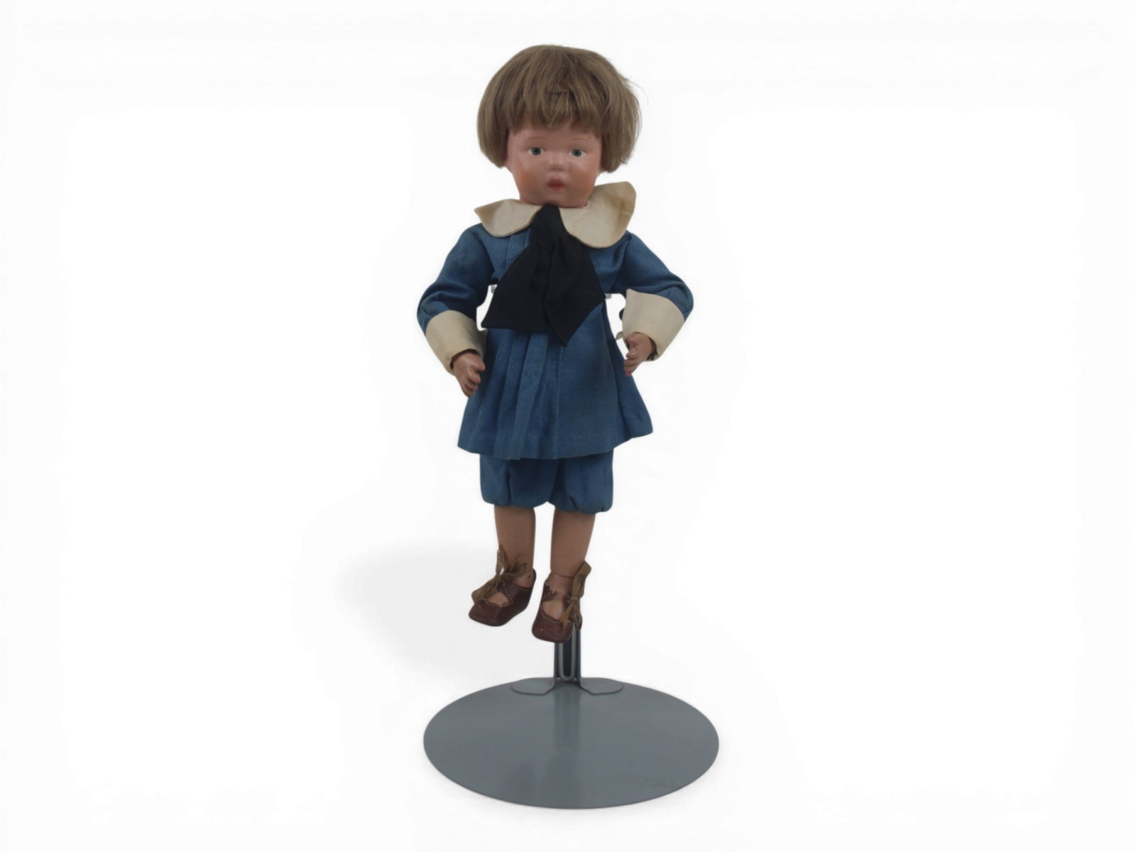 Schoenhut Wooden Doll: 12 inch fully articulated wooden Schoenhut doll with green date stamp on neck and original paint and costume. Circa 1913. Shipping: Weiss Auctions offers full-service, in-house shipping for nearly all