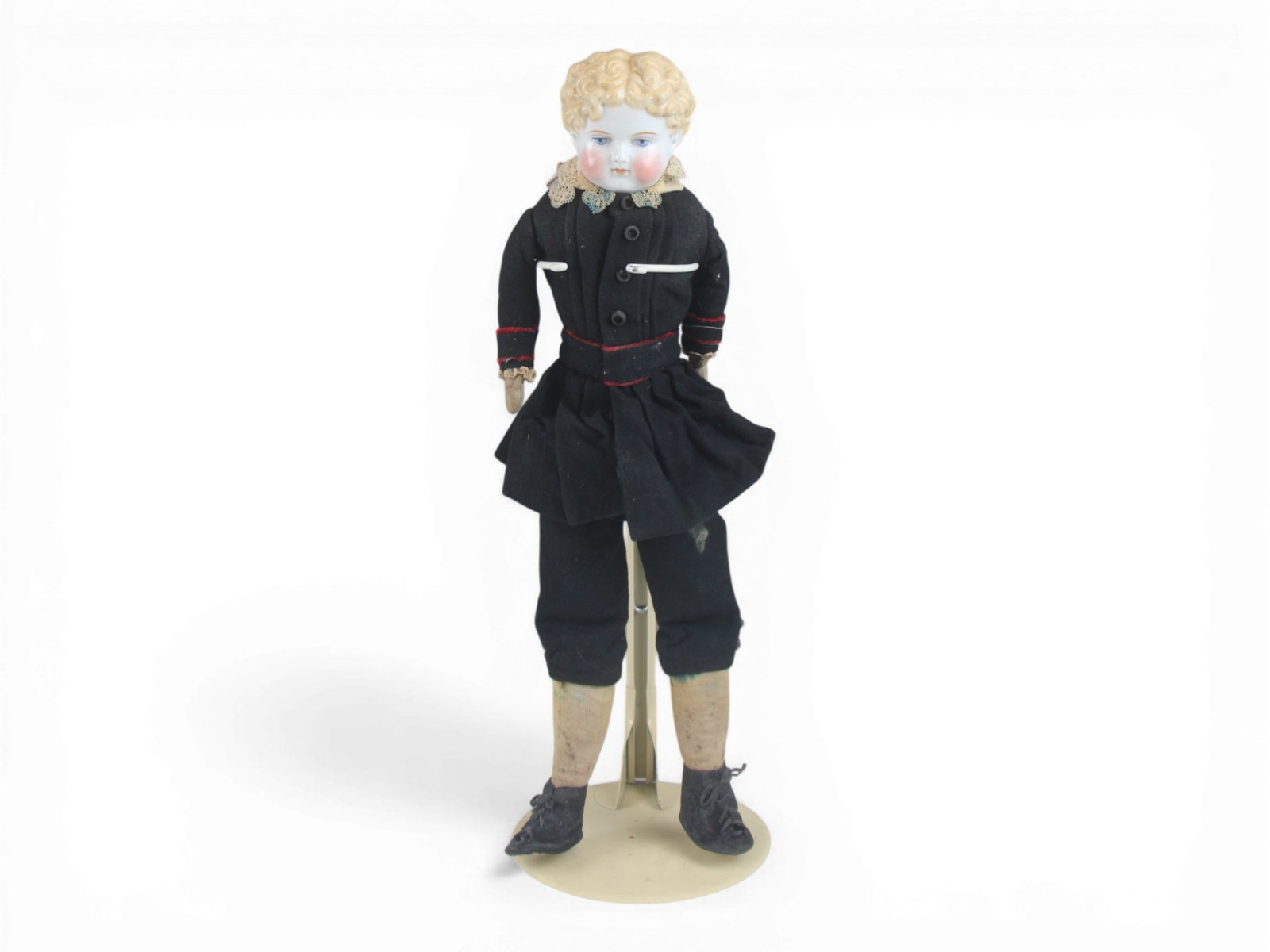 China Head Boy Doll: 21 inch china head boy doll with cloth body and original costume. Circa 1890s. Shipping: Weiss Auctions offers full-service, in-house shipping for nearly all items in this auction. For a shipping