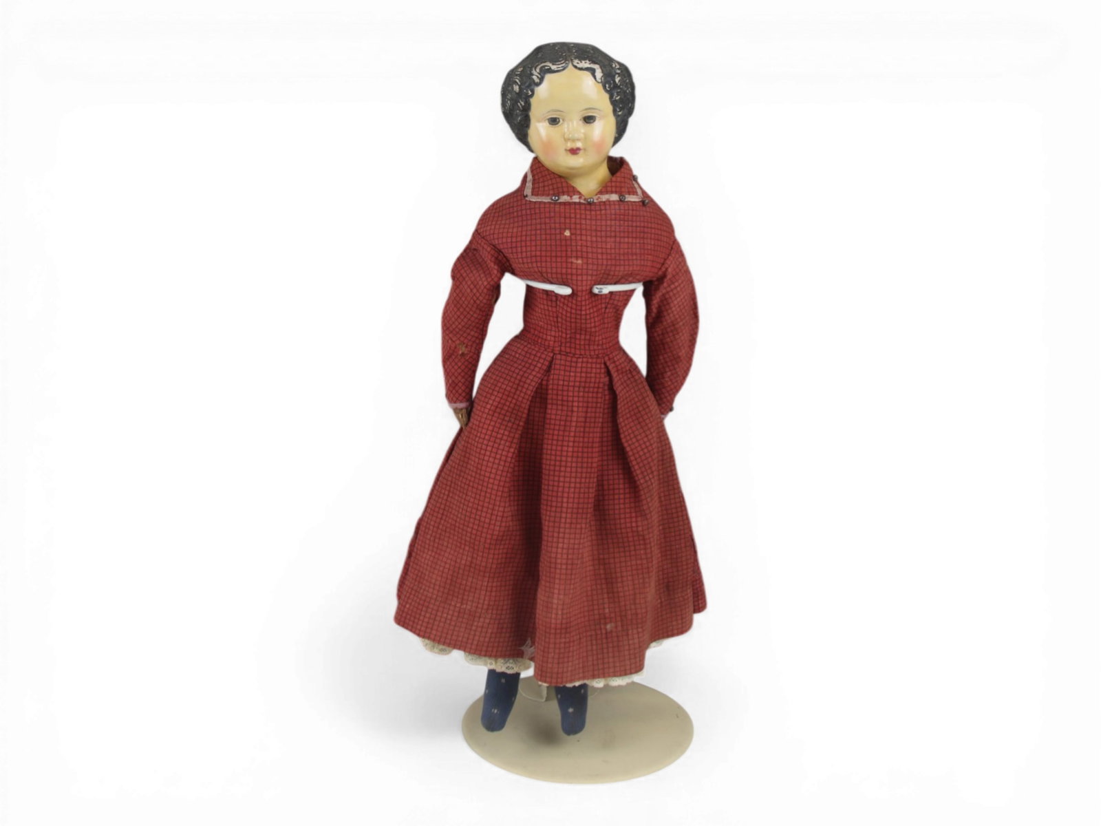 German Papier Mache Doll: 22 inch papier mache head on cloth body with original clothes. Face entirely repainted. Circa 1850s. Shipping: Weiss Auctions offers full-service, in-house shipping for nearly all items in this