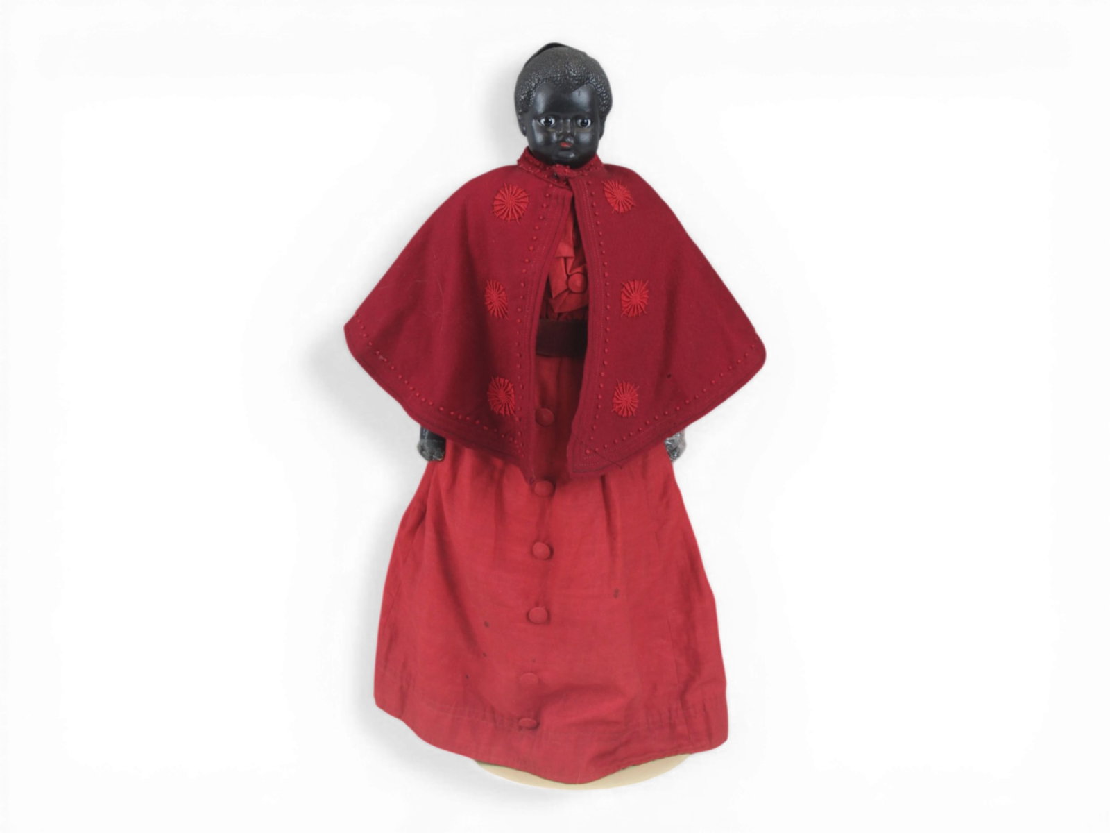 Black Papier Mache Antique Doll: 22 inch papier mache head on cloth and leather body with original costume. Hands are frail, damage to back of head, and repaired shoulder plate. Possibly American. Circa 1860s. Very rare. Shipping: We