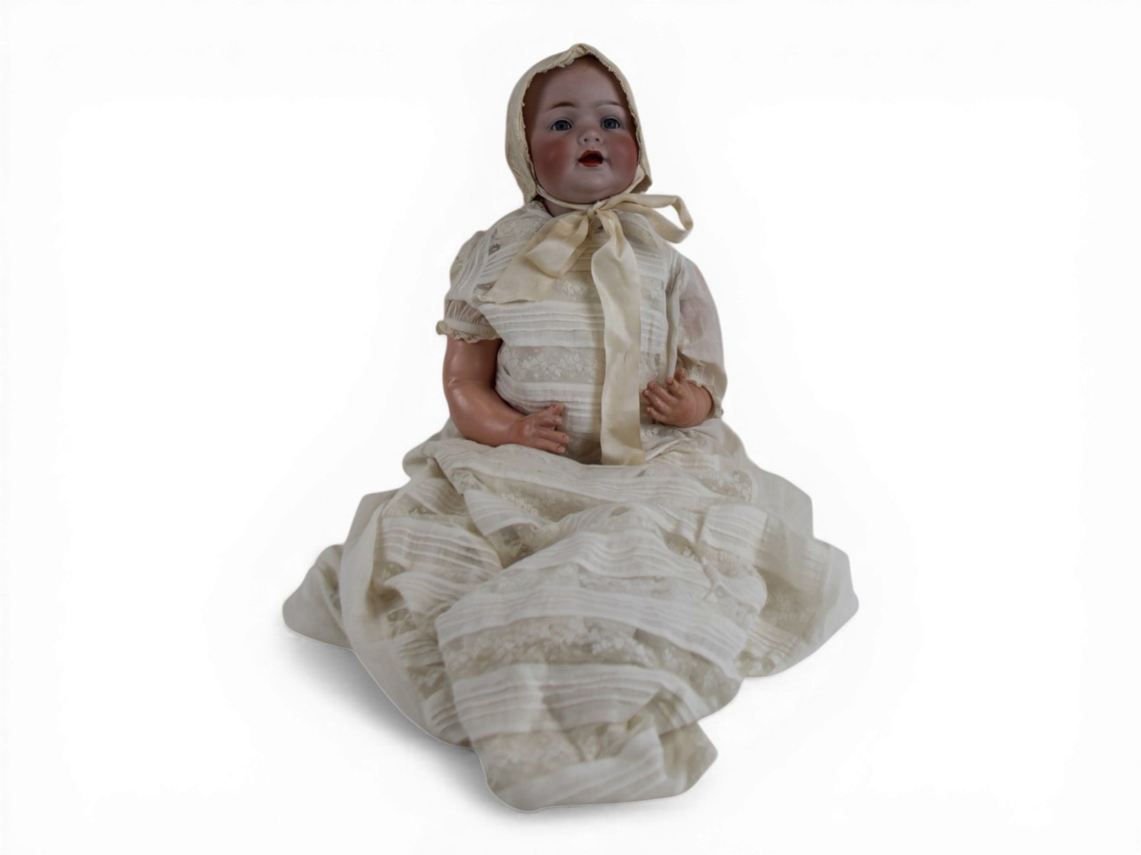 JD Kestner Solid Dome Baby Doll: 21 inch bisque solid dome head on bent limb composition baby body. Circa 1920s. Shipping: Weiss Auctions offers full-service, in-house shipping for nearly all items in this auction. For a shipping